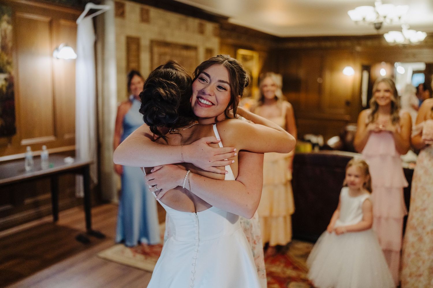 A series of emotional wedding moments captured in warm lighting at an indoor venue.
