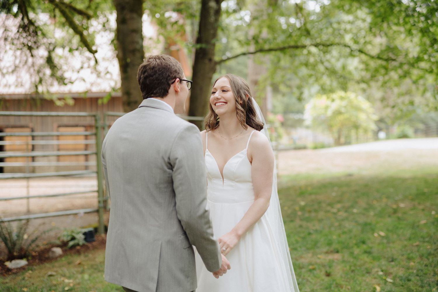 Romantic outdoor wedding ceremony in a lush green garden setting.