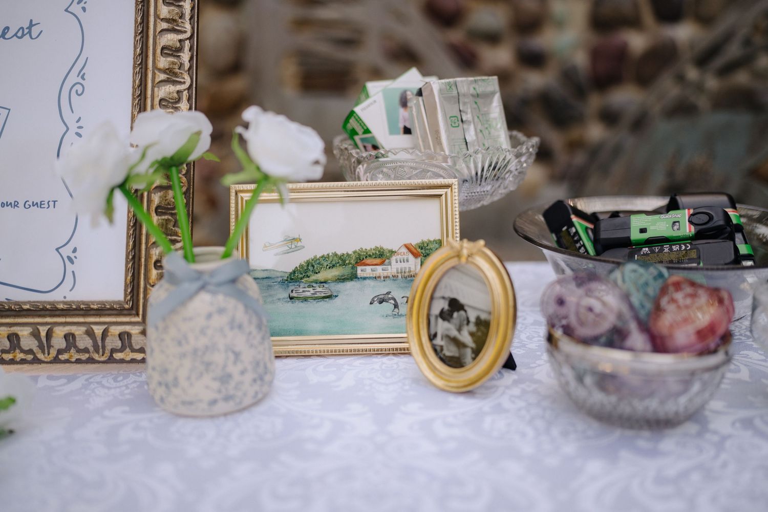 Vintage-style wedding decor details arranged on display table.