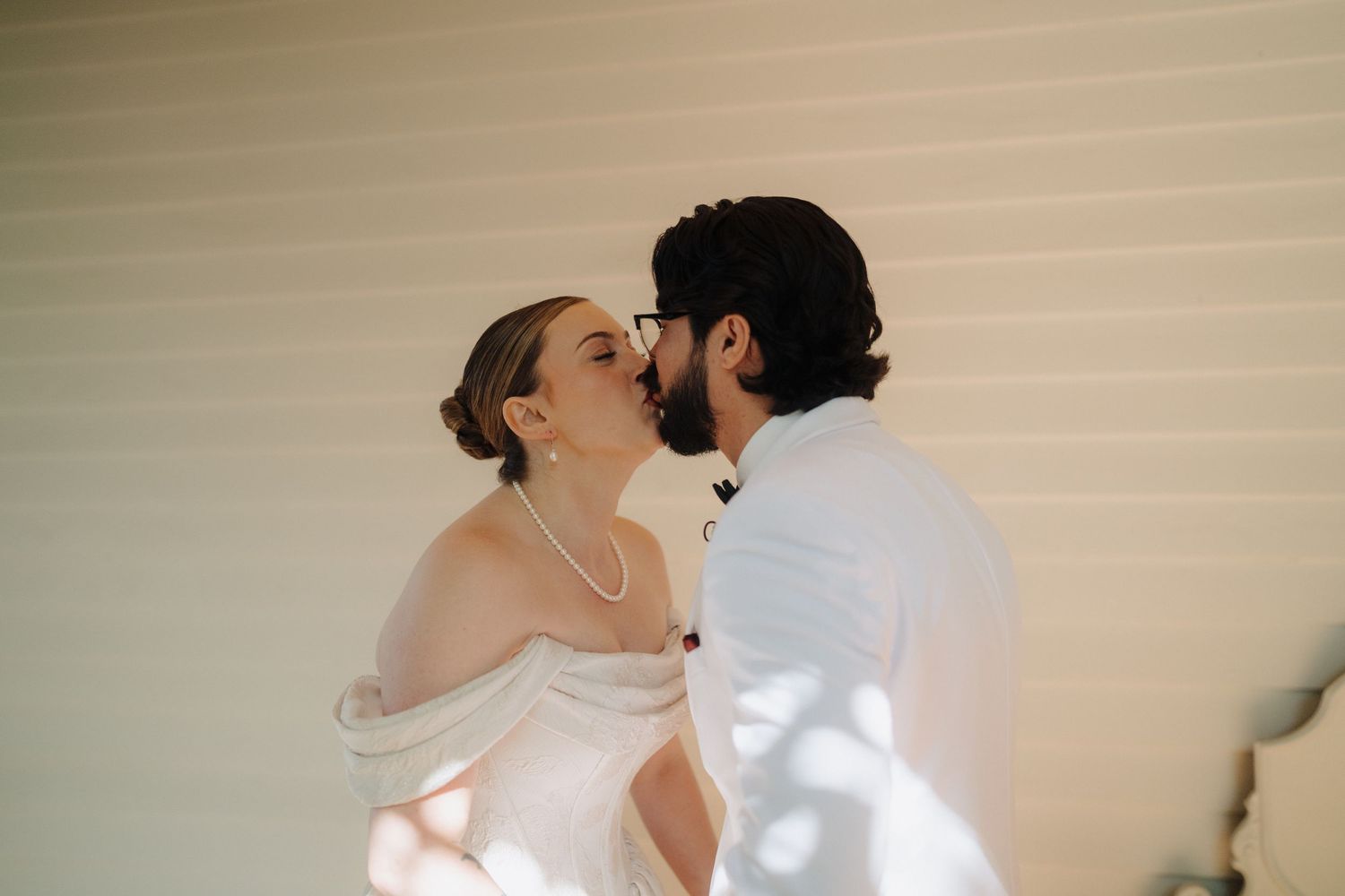 A couple shares an intimate moment during their outdoor wedding ceremony.