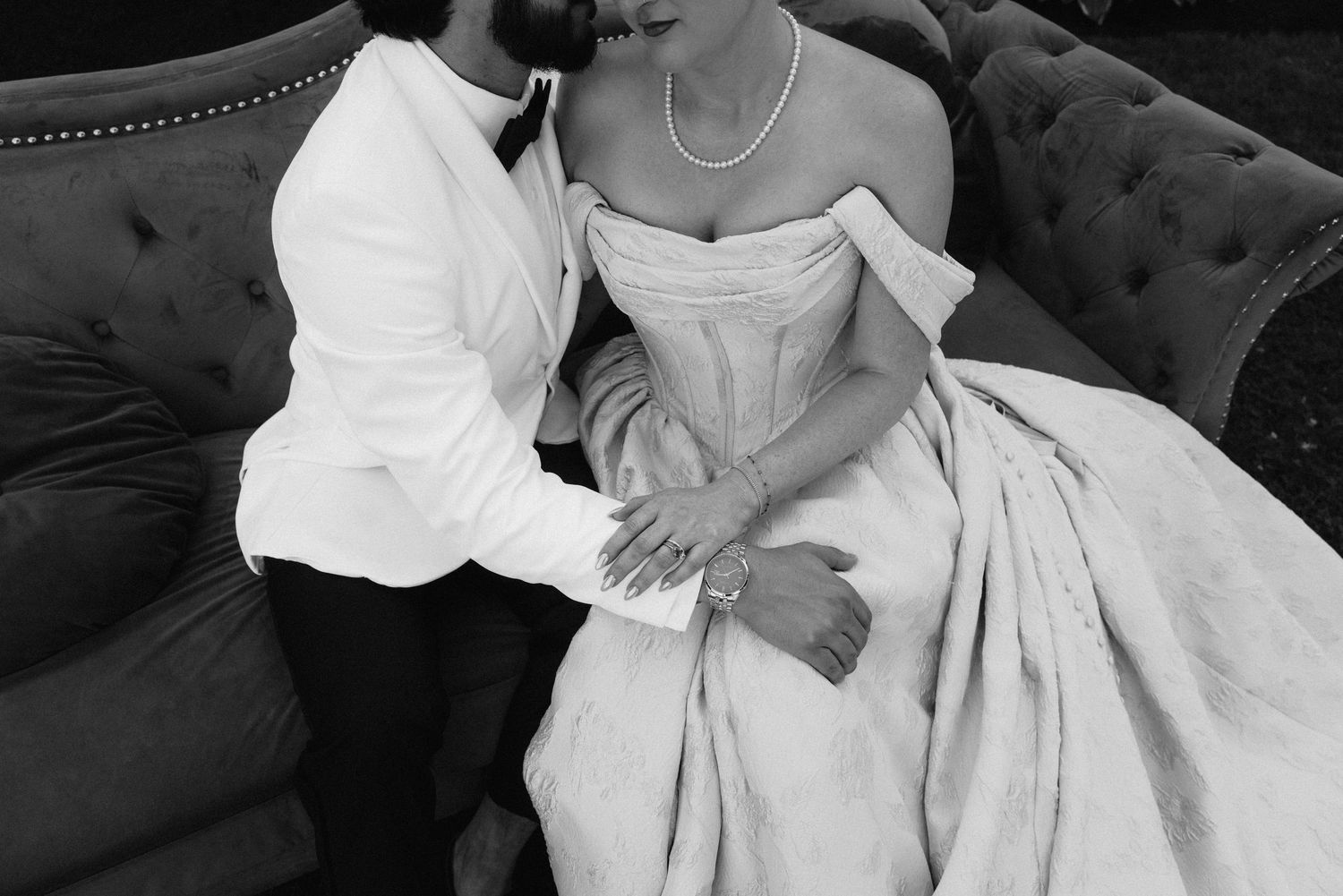 Black and white portraits showcase the intricate details of a wedding dress.