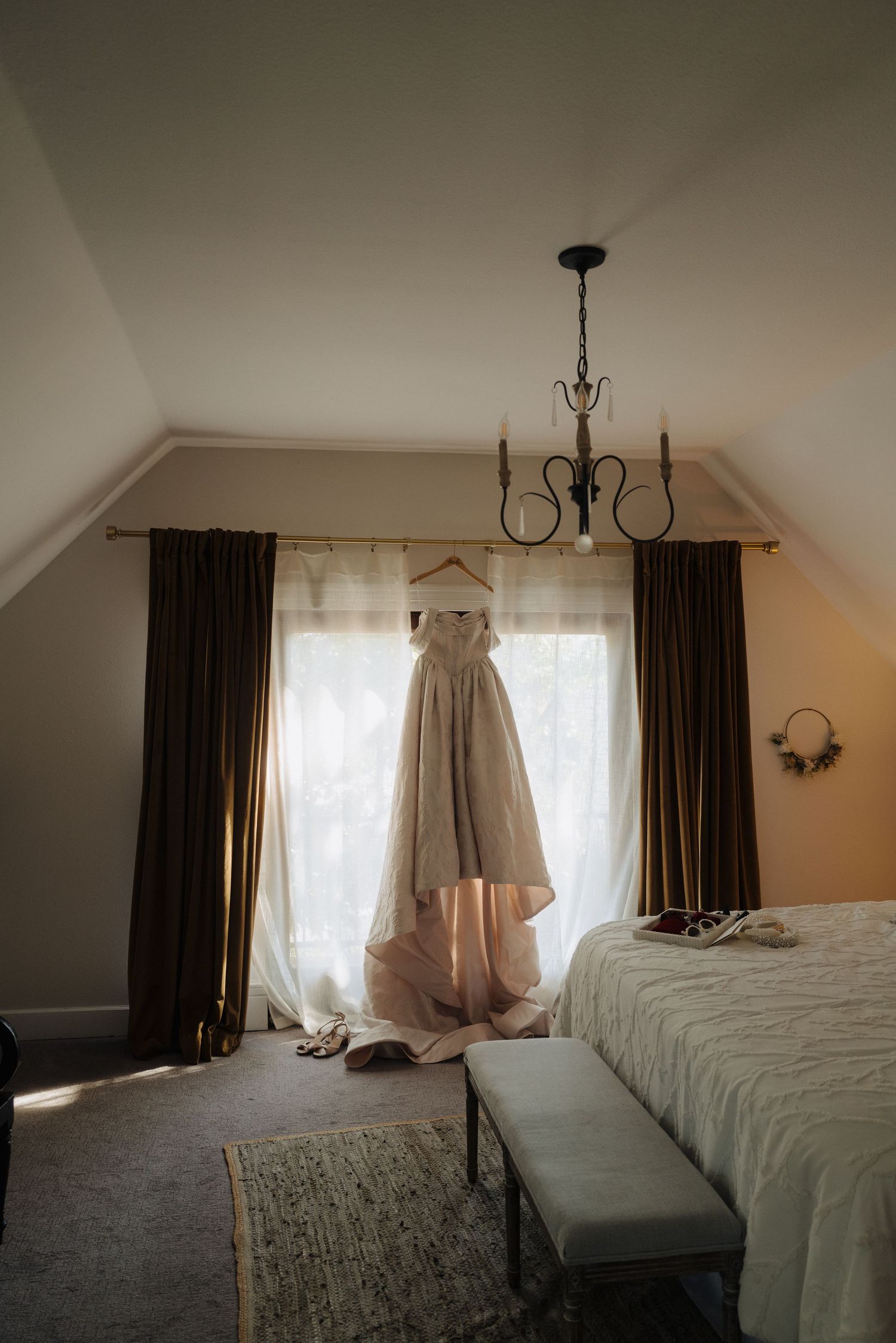 A series of photos showing a bridal gown hanging in a sunlit bedroom with dark curtains and white walls.