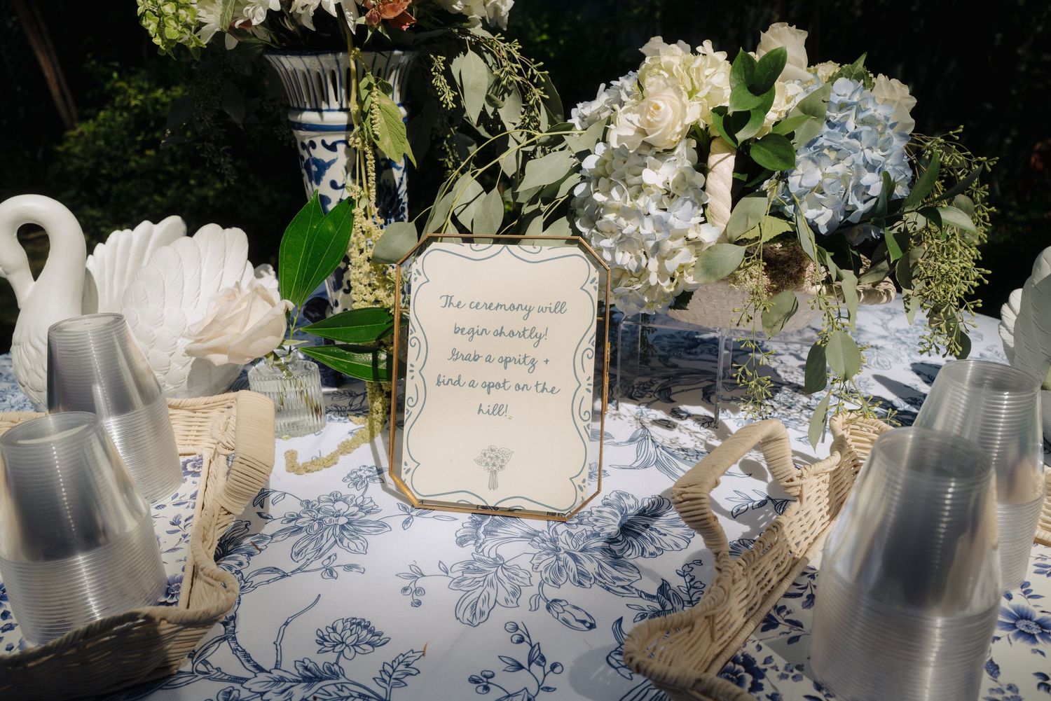 Elegant wedding reception table settings with white linens and delicate decorative details.