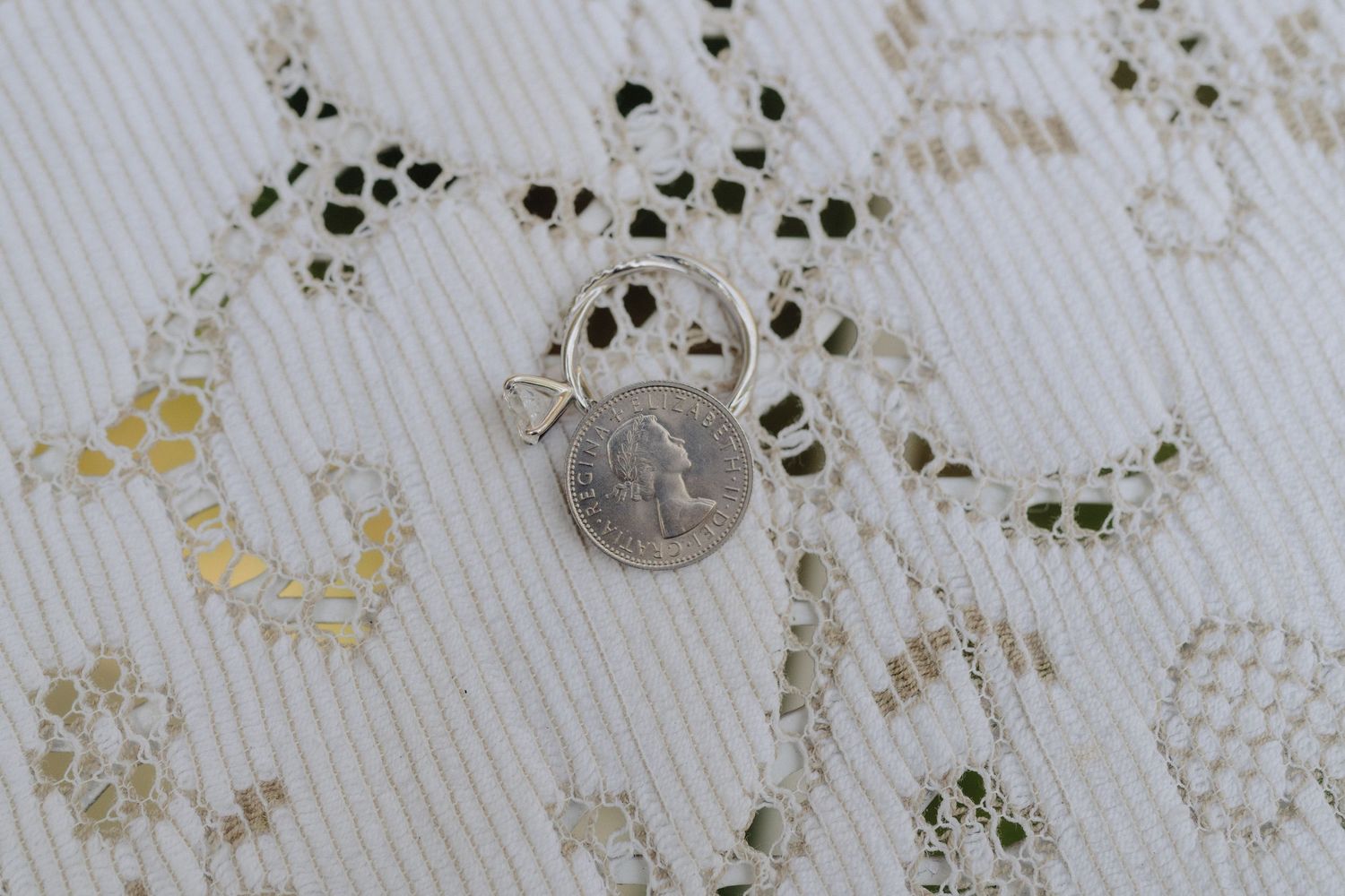 Small black paw print patterns stamped in a repeating design on white textured paper with gold metallic accents.