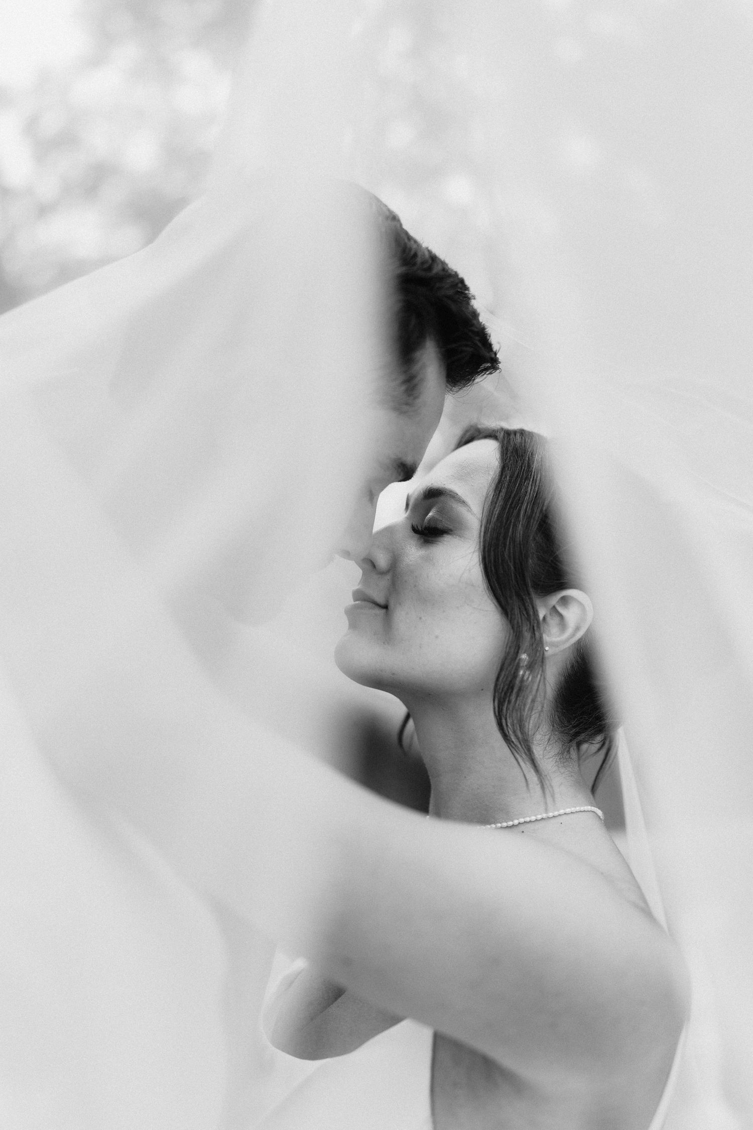 Artistic black and white profile portraits showing elegant bridal details.