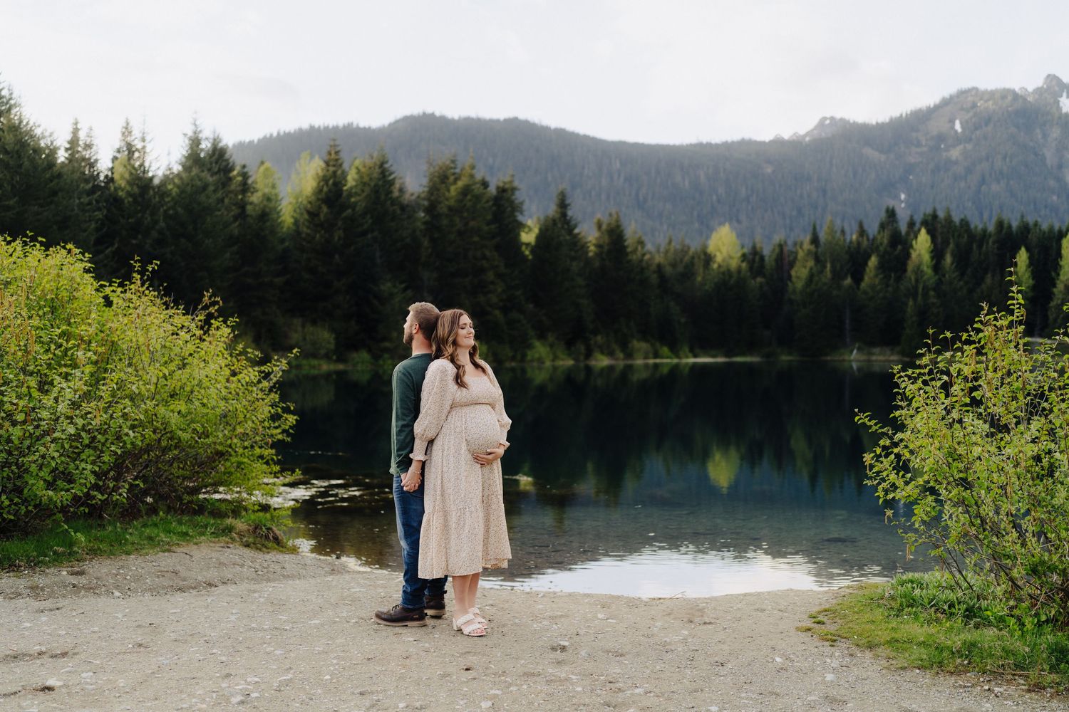 Series of intimate moments photographed along a peaceful mountain lake with scenic mountain views.