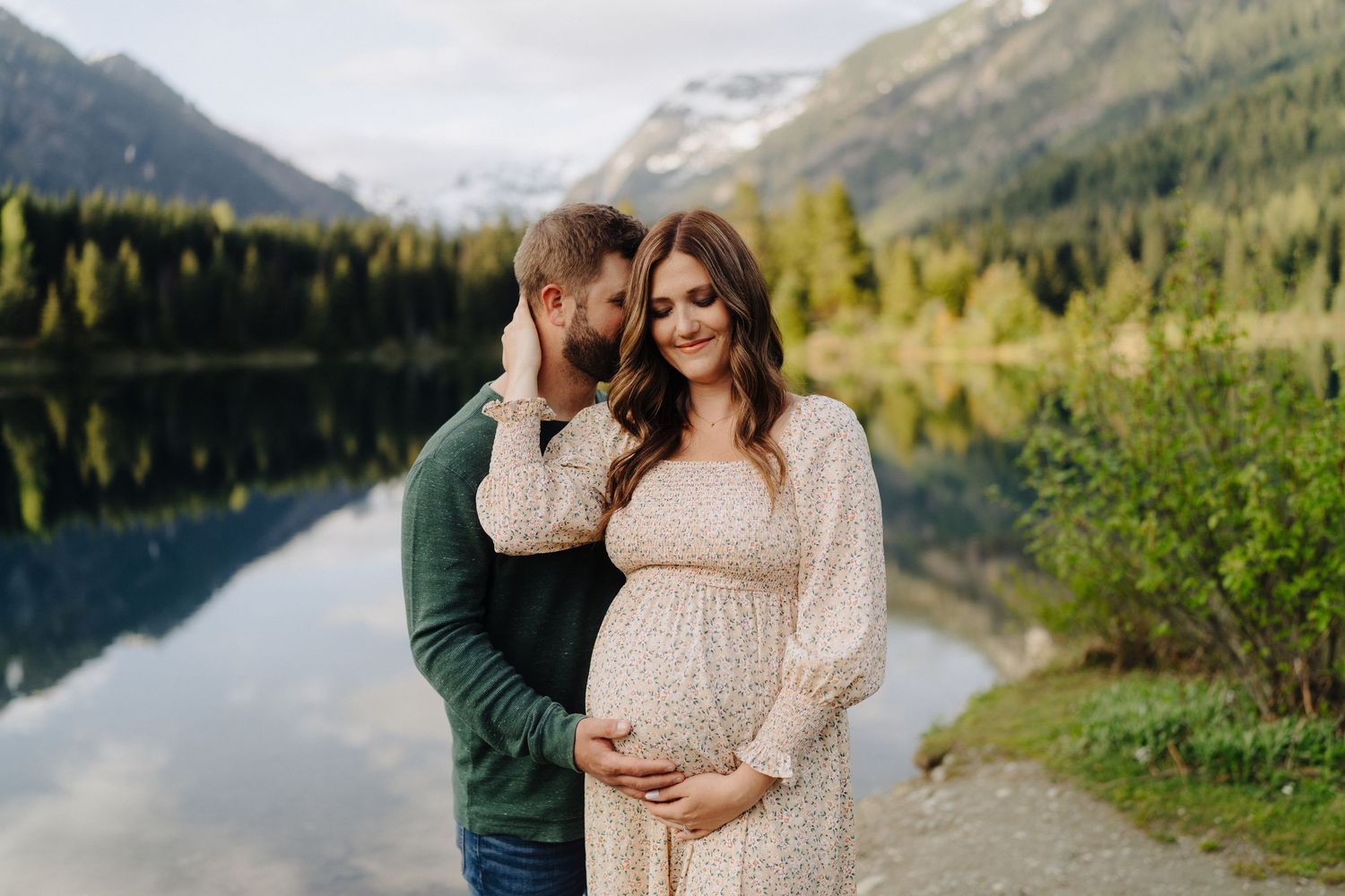 Beautiful mountain landscape serves as backdrop for intimate lakeside photo session.