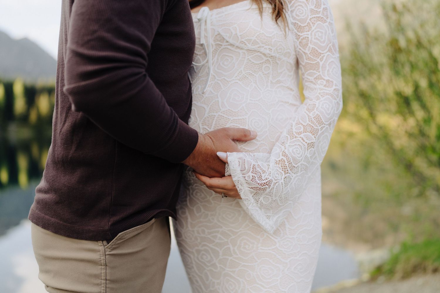 Close-up moments captured in soft light with delicate lace details.
