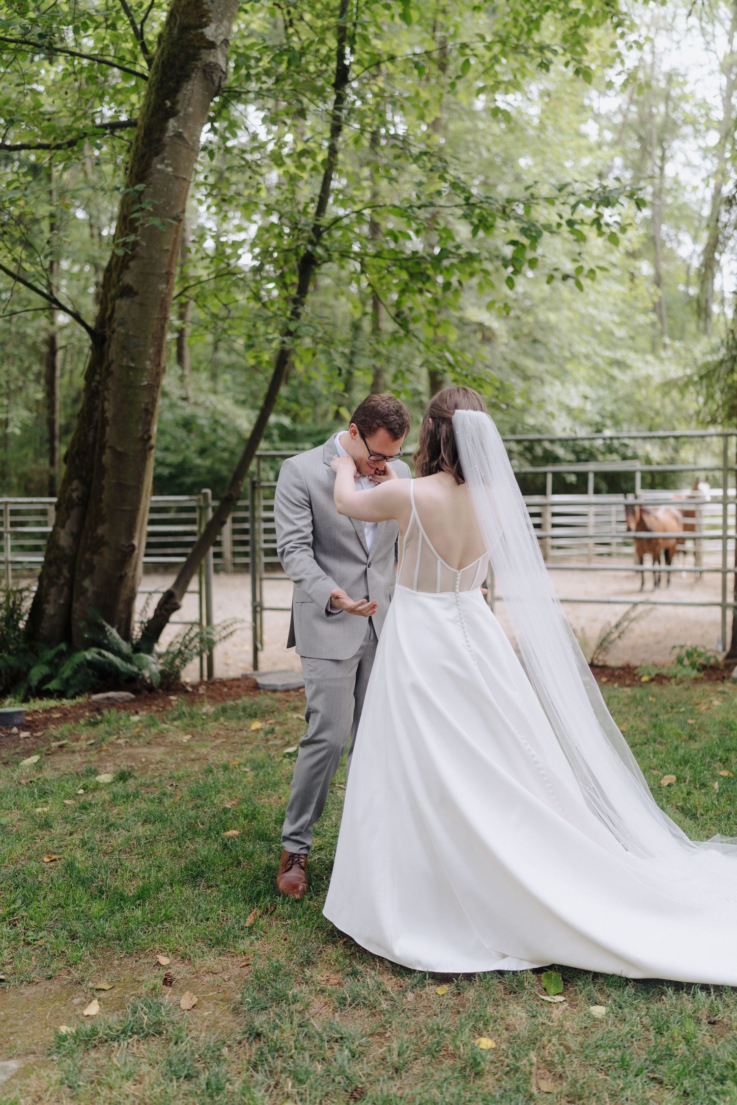 A romantic wedding photoshoot sequence in a lush green garden setting with a flowing white dress and grey suit.