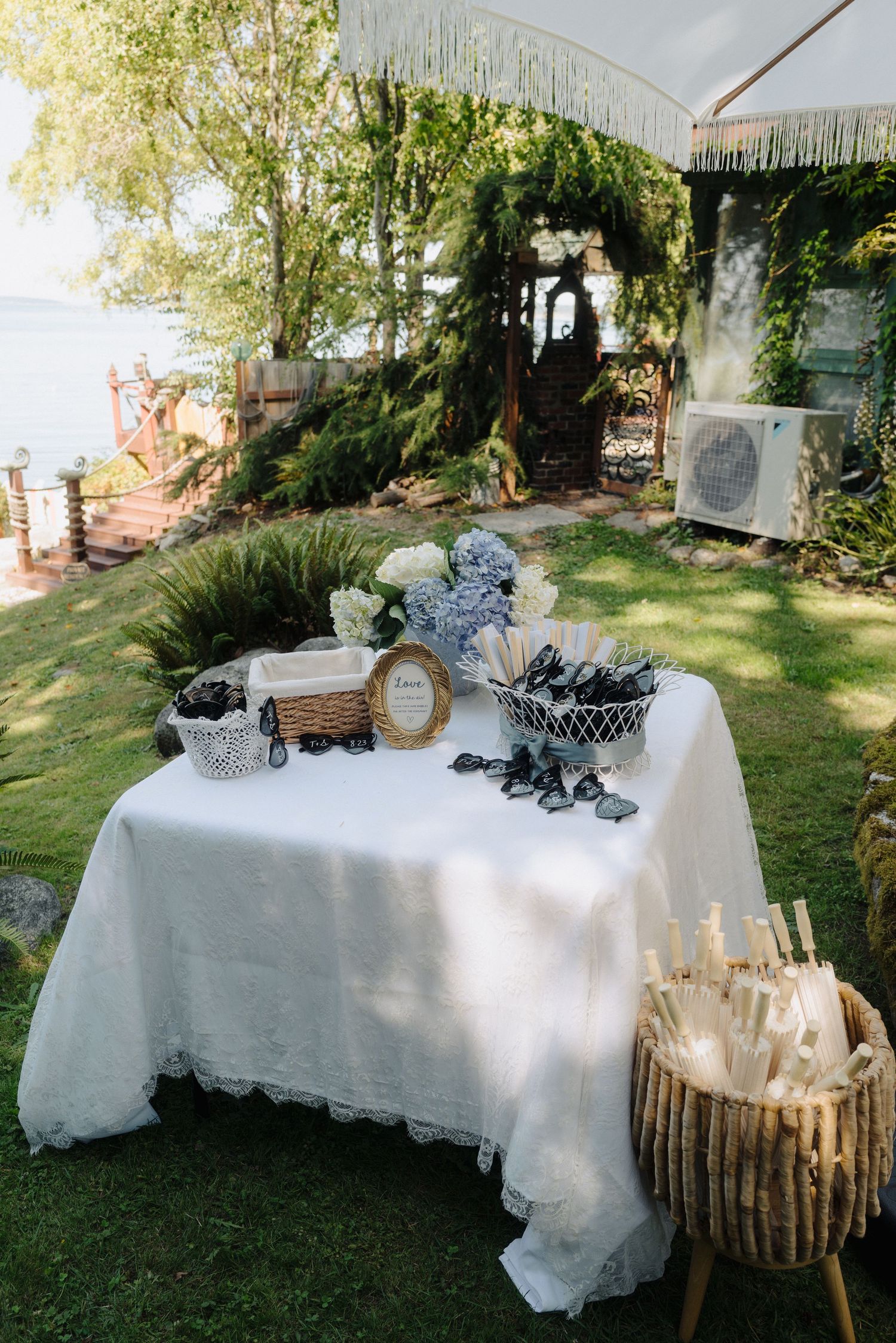 Vintage-inspired outdoor wedding decor featuring white tables and rustic elements.