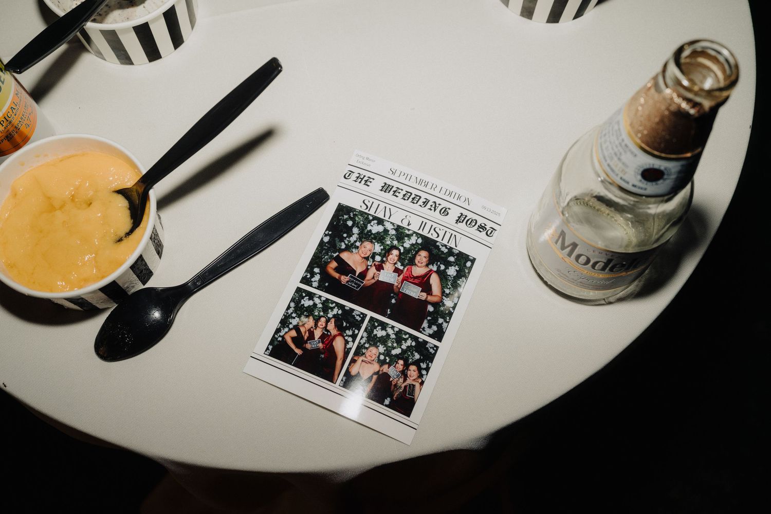 Wedding reception table details with black and white striped decor elements.