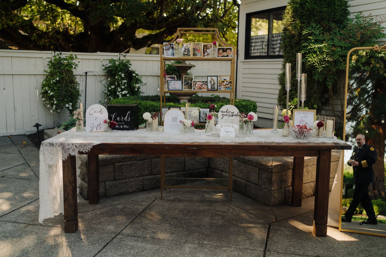 A rustic outdoor wedding venue with white chairs set up for a ceremony.