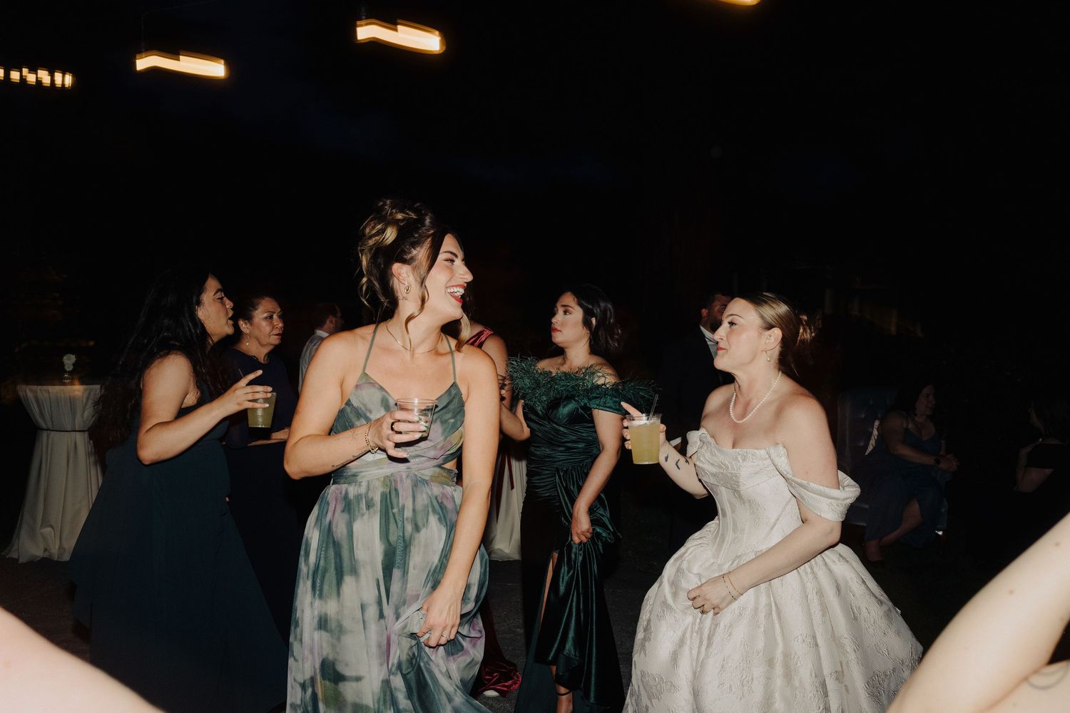 Wedding reception dance party with guests enjoying the evening celebrations.