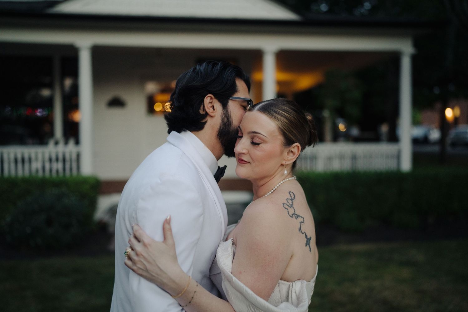 Couple sharing their first dance at an evening wedding reception.