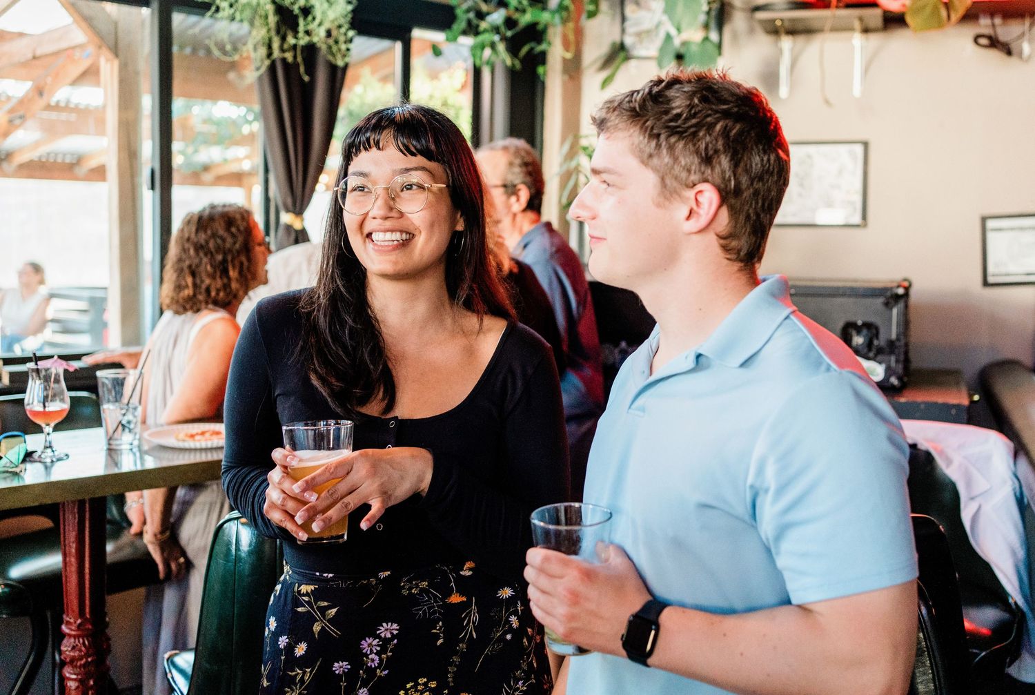 A candid celebration photo shows joyful moments at what appears to be a social gathering.