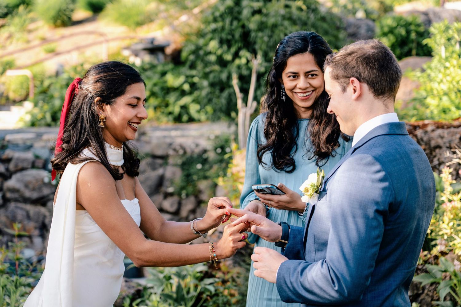 Series of candid wedding photos showing couple sharing intimate moments in garden landscape.