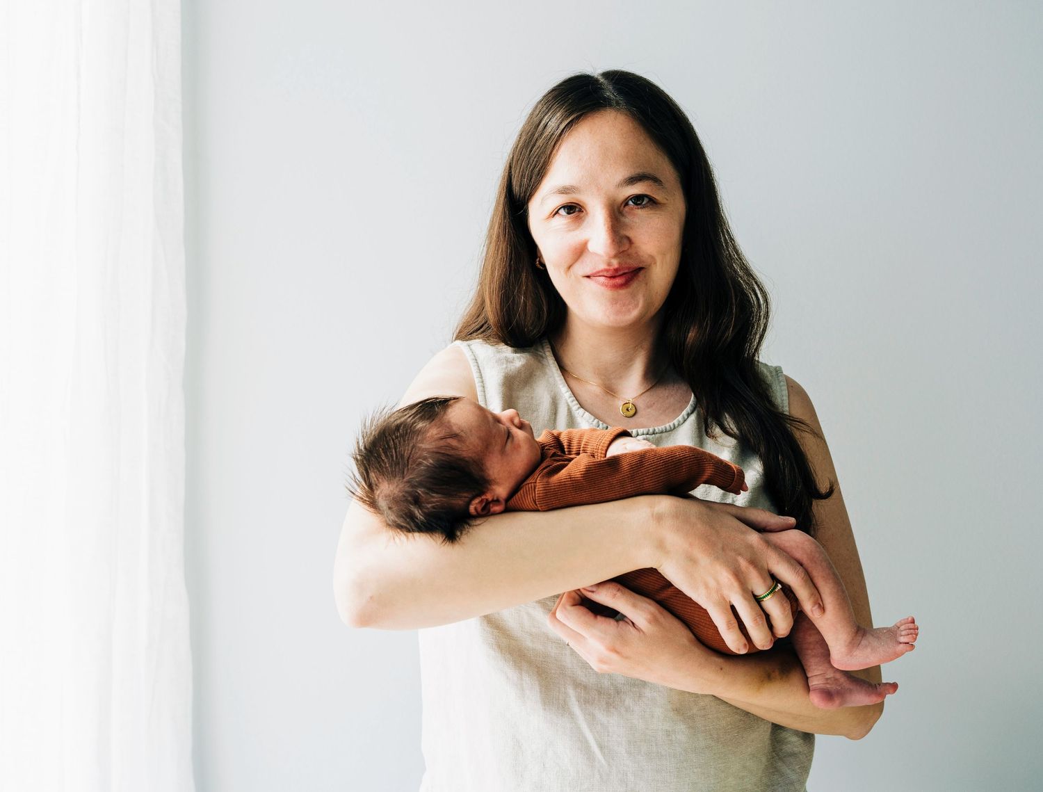 Gentle interactions captured in a bright, minimalist indoor setting.