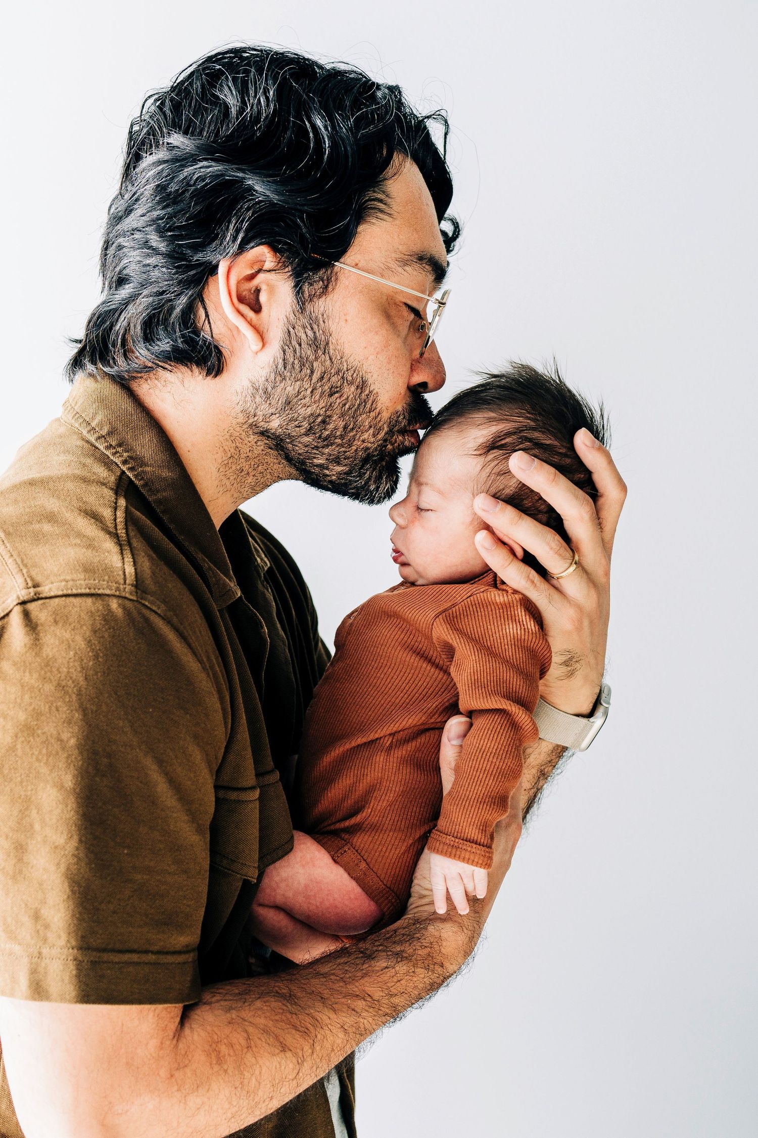 Heartwarming series of parent and child interactions captured in a studio setting.