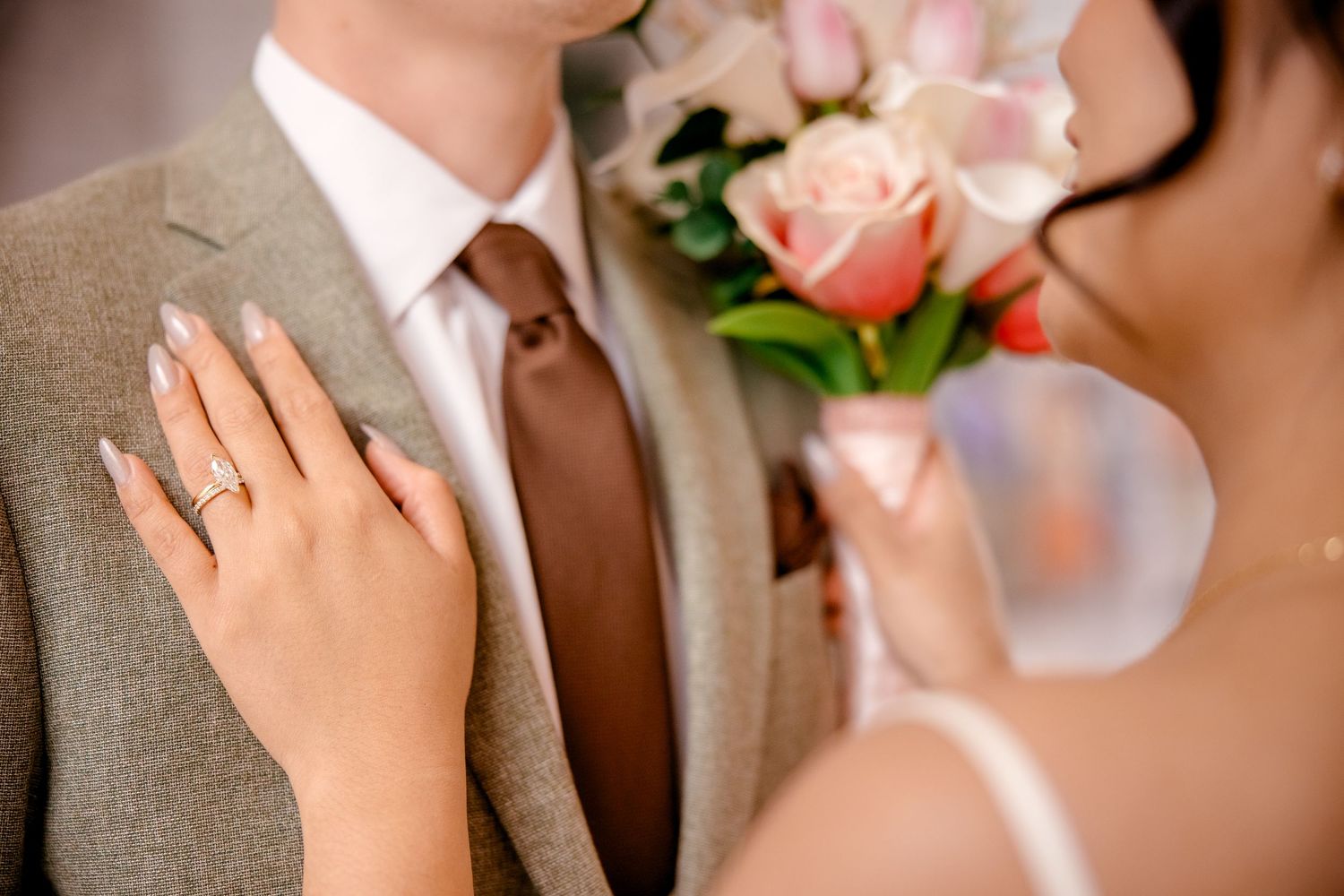 Intimate wedding moment captured with soft focus and natural lighting.