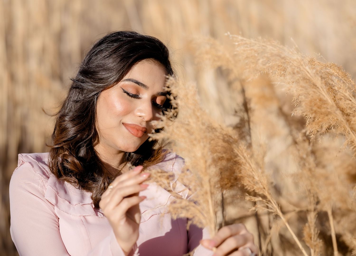 Artistic portrait series in a golden wheat field with soft natural lighting.