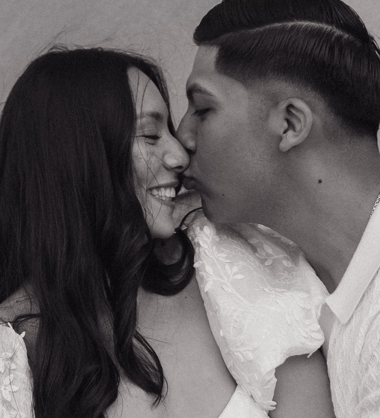 Close-up of a tender moment between a couple sharing laughter.