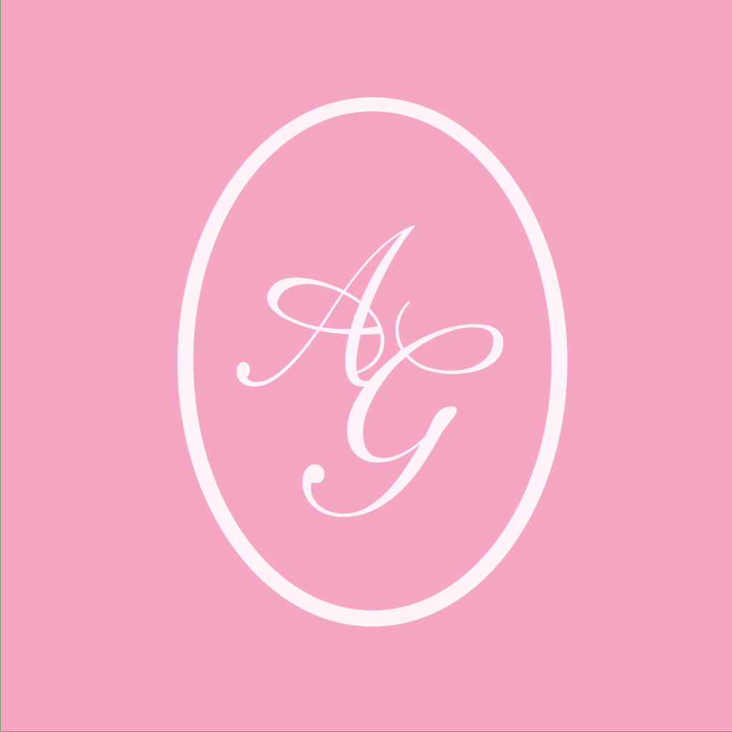 White elegant monogram letters AG in cursive script design on oval shape against pink background.