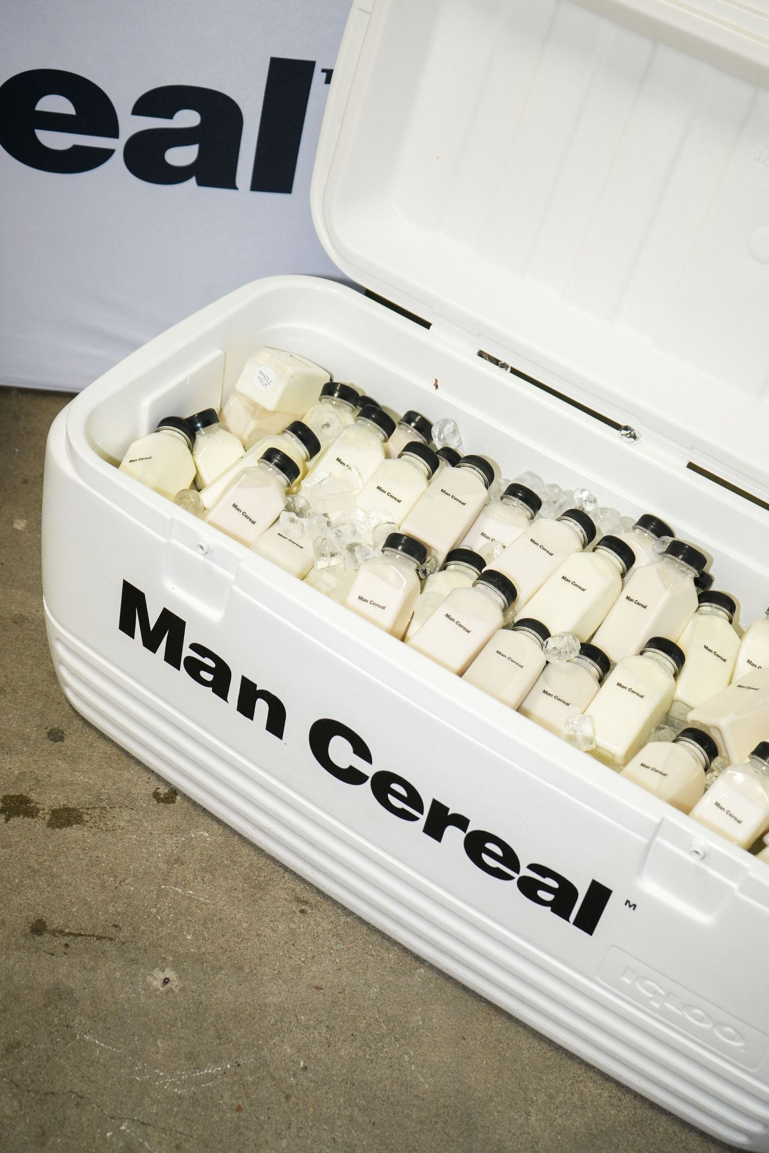 Close-up sequence of white M Gear branded equipment parts arranged in a row.