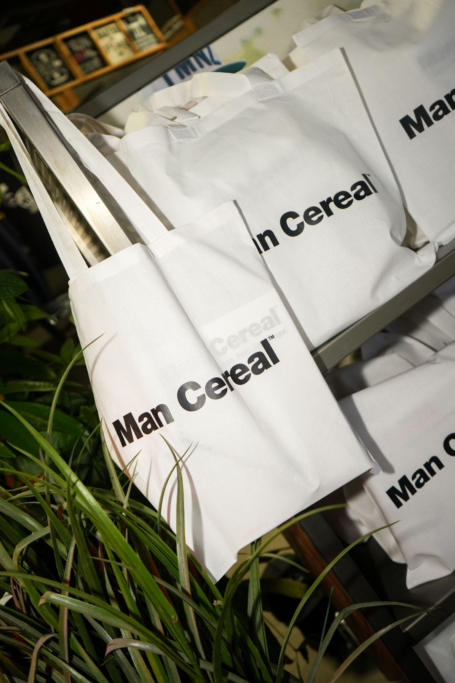 White paper bags with text scattered on grass in natural lighting.