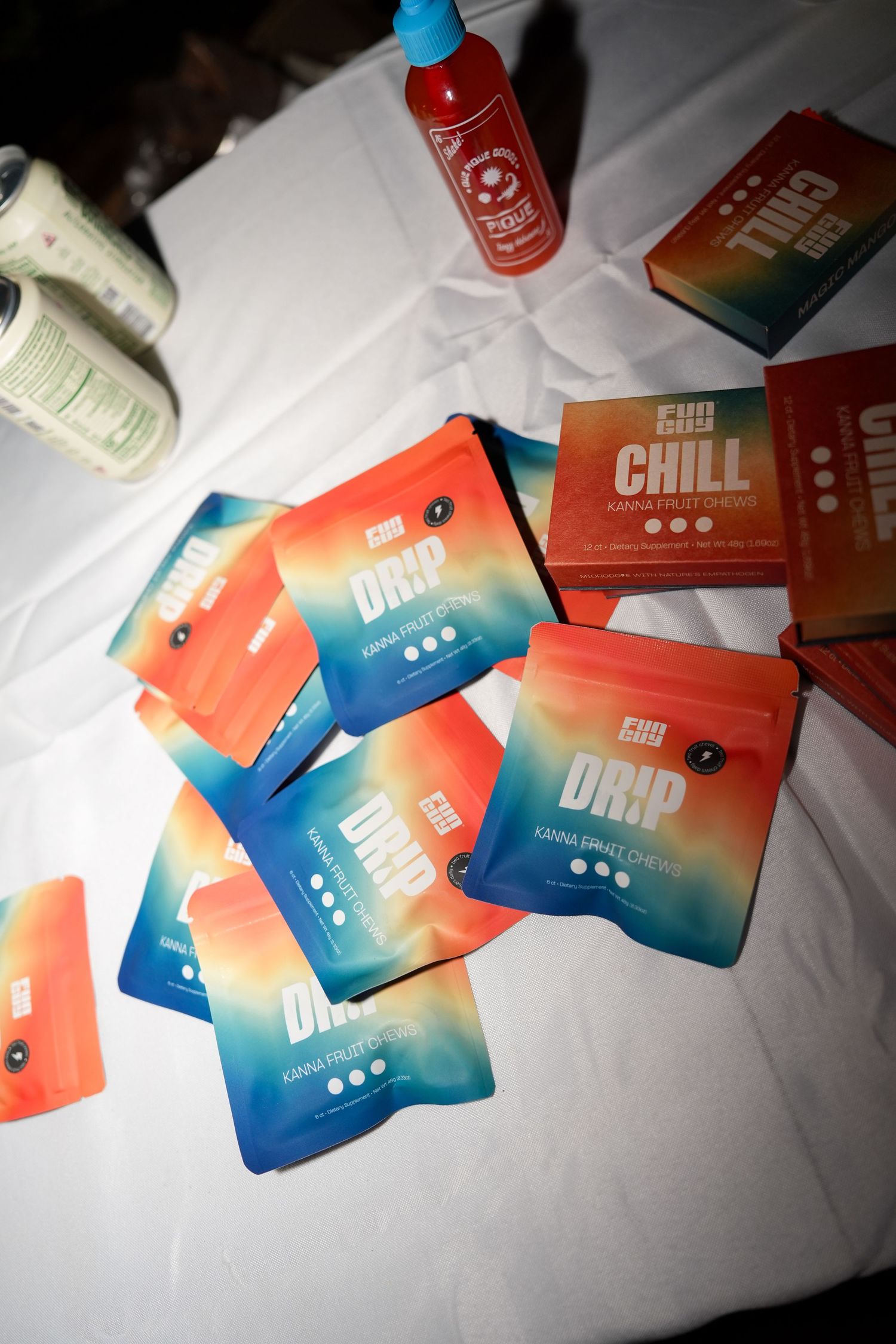 Colorful gradient business cards featuring blue and orange designs scattered on a white surface.