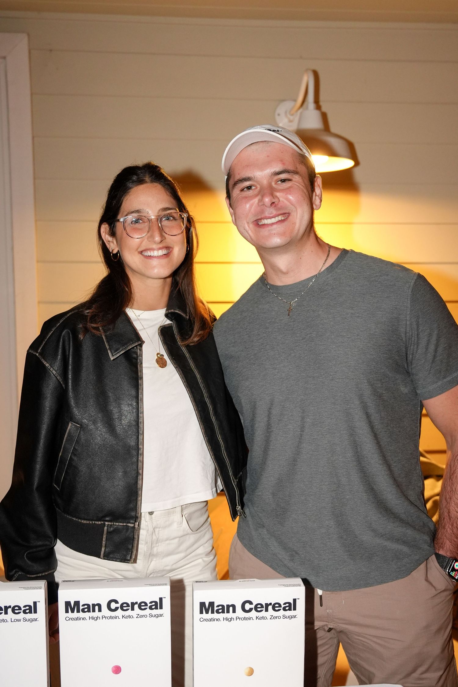 Two people in casual attire pose together in a series of similar photos showing their friendship and smiles.