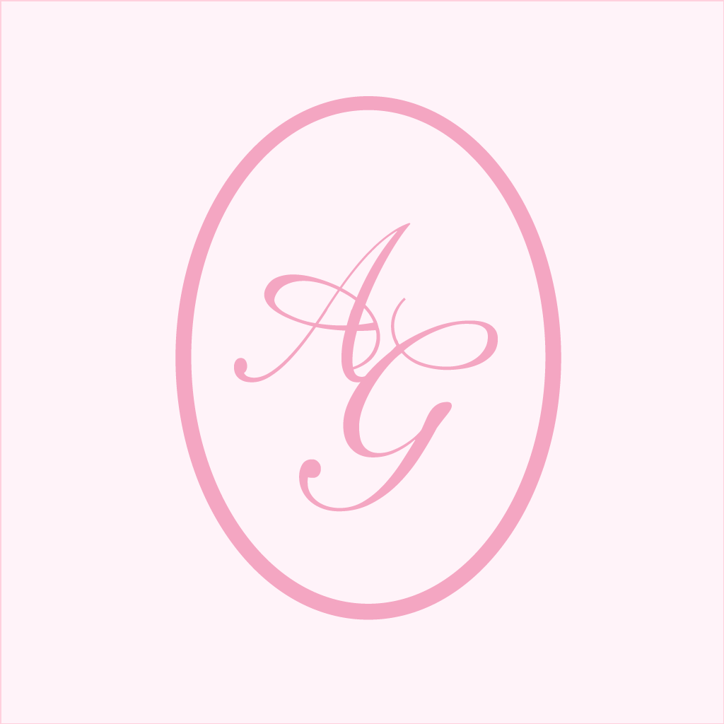 Elegant pink monogram design featuring script letters AG in an oval frame on a light pink background.