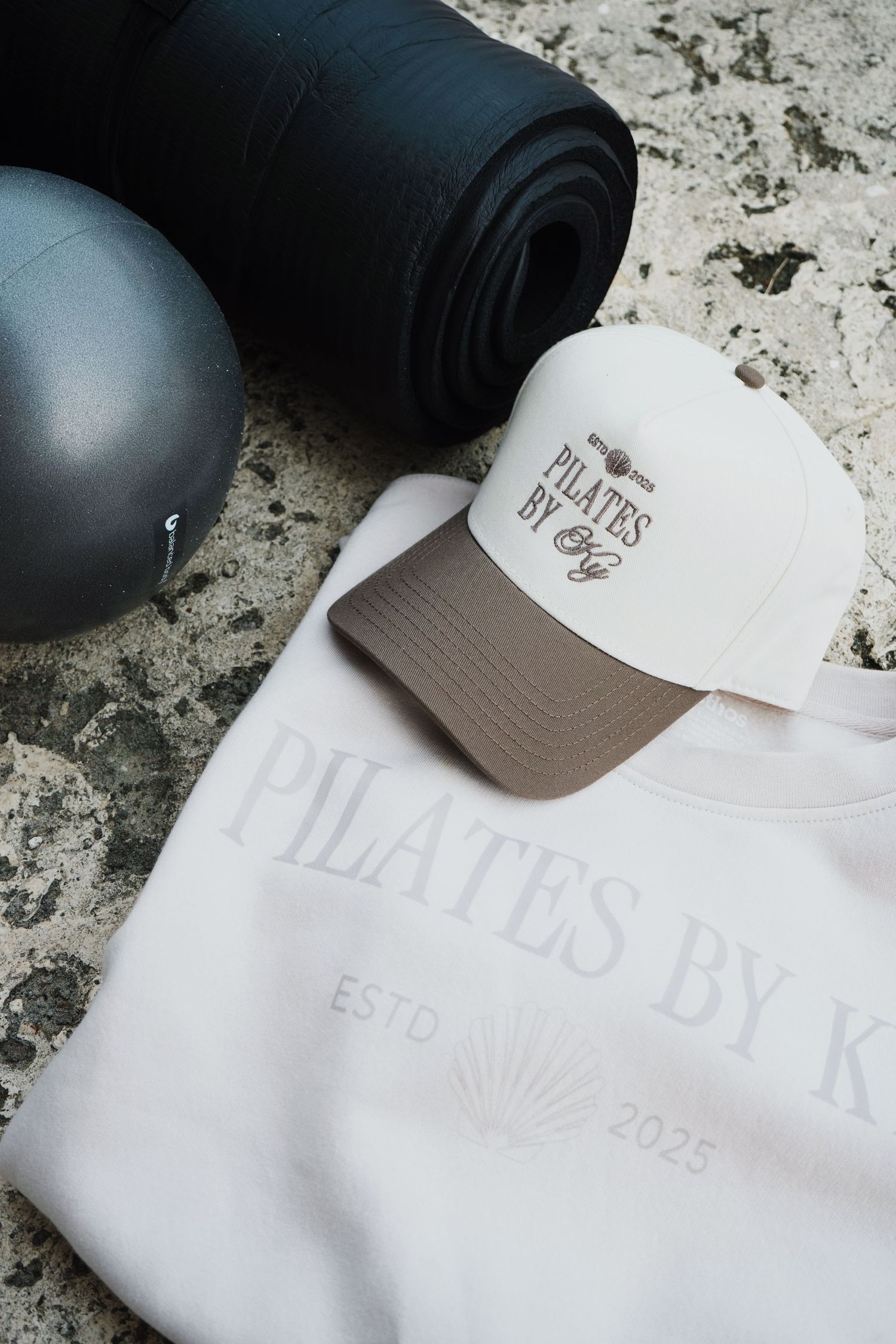 A sequence of photos showing details of a white embossed baseball cap with a tan accent and logo patch.