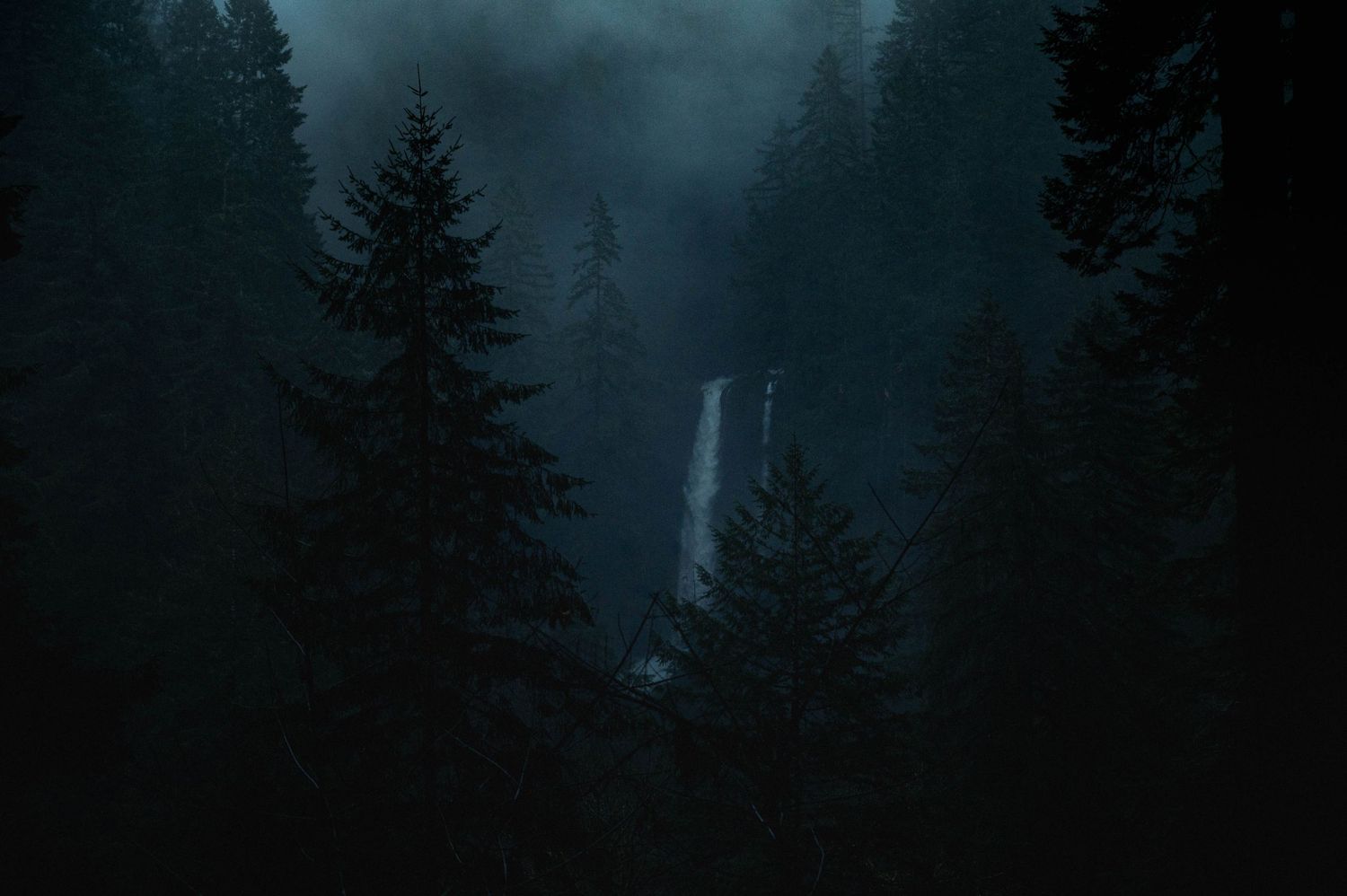 Moody, foggy landscape of a waterfall at Silver Falls State Park in Oregon
