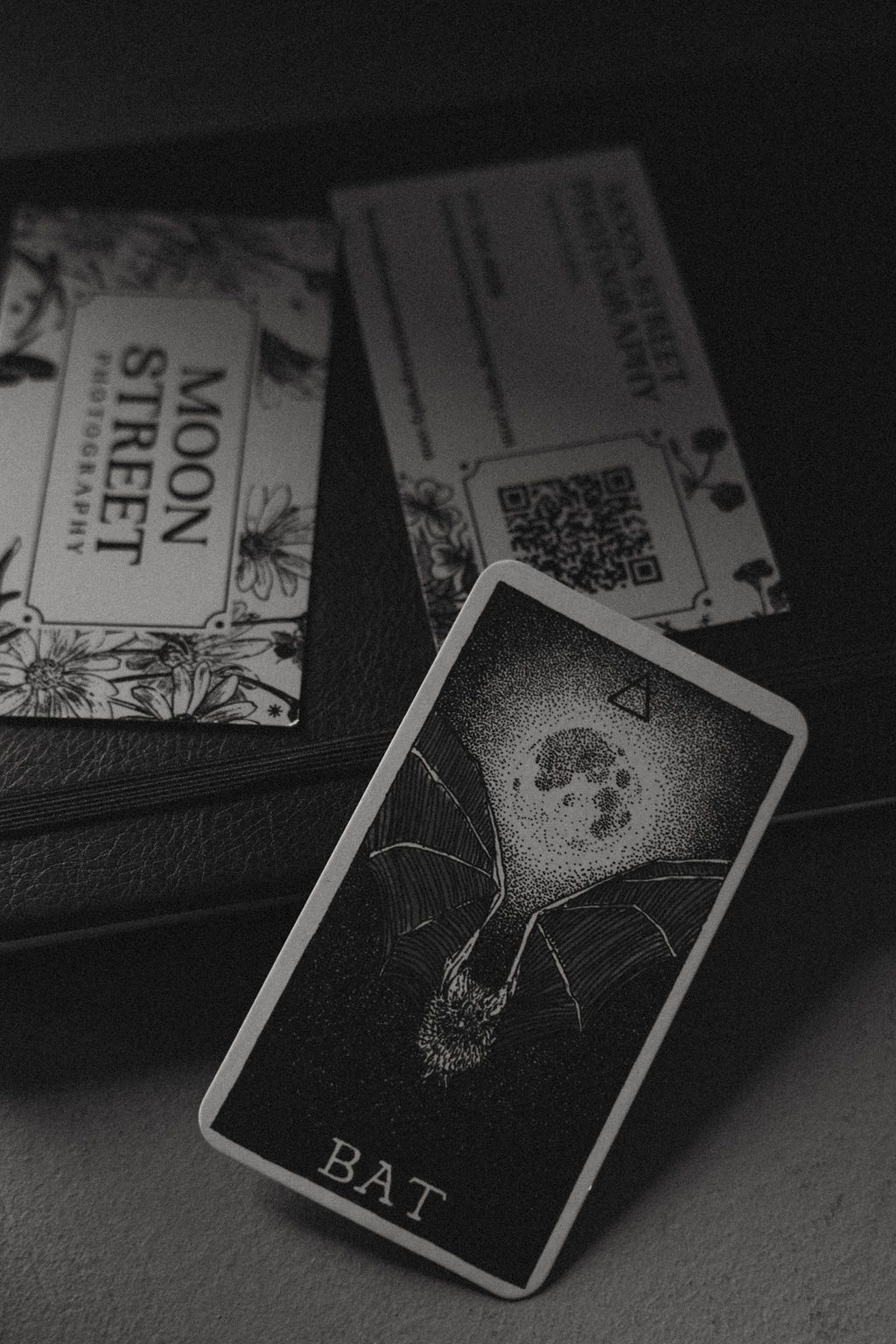 Black and white of Moon Street Photography business card and Bat tarot card by Her Creative Photography