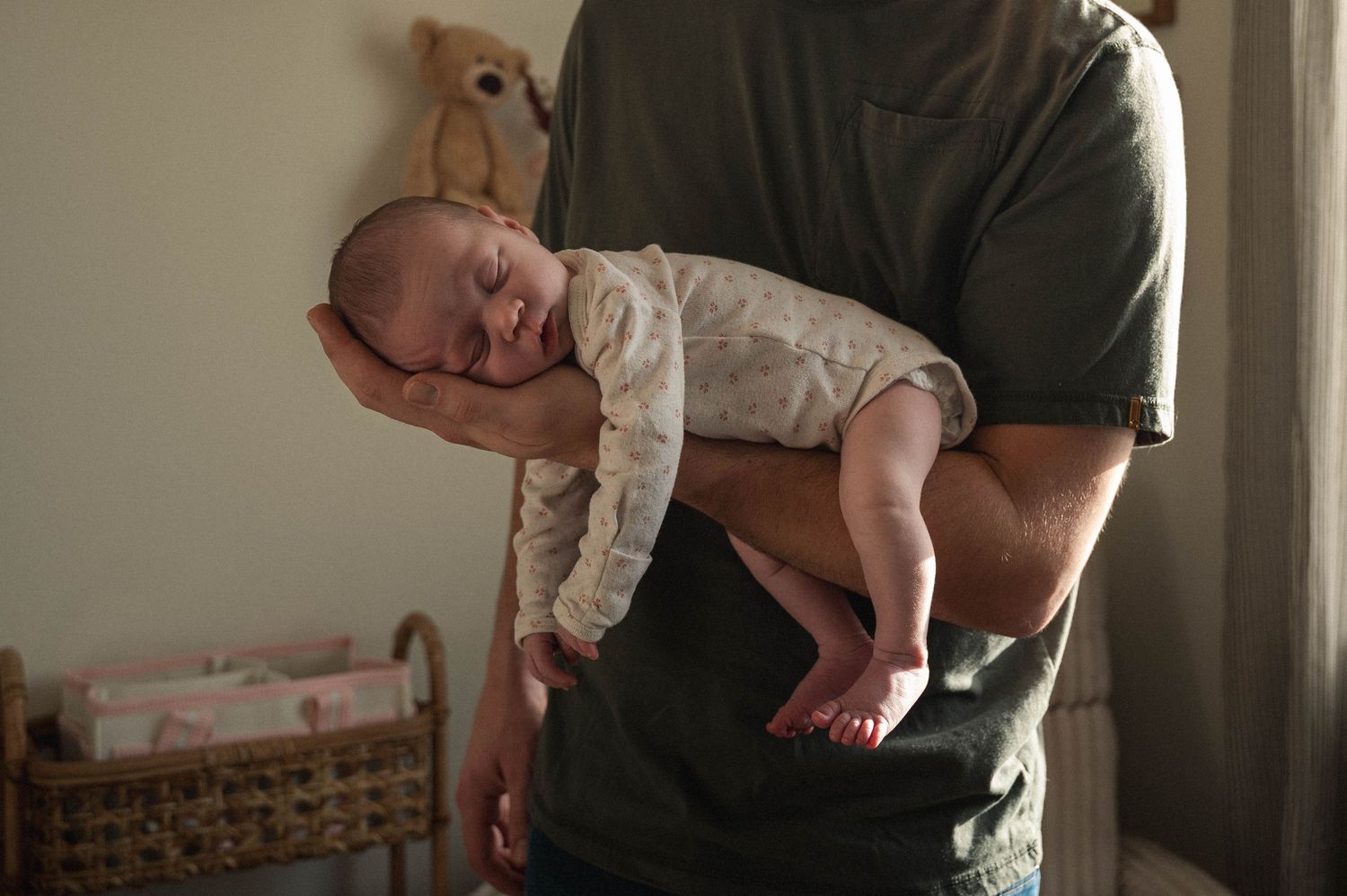 A series of tender moments between a parent and baby shown in four connected photographs.