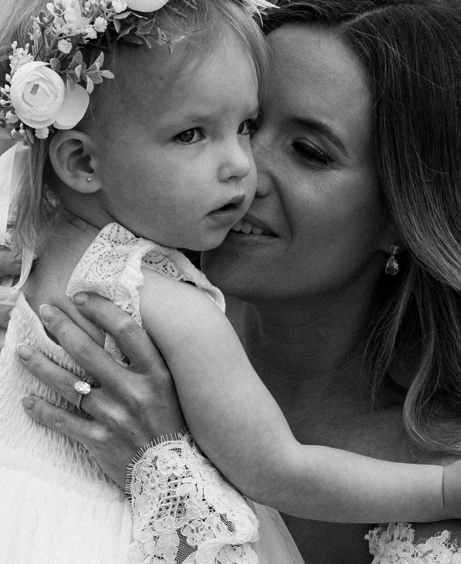 Sweet moment between parent and young child at formal event.