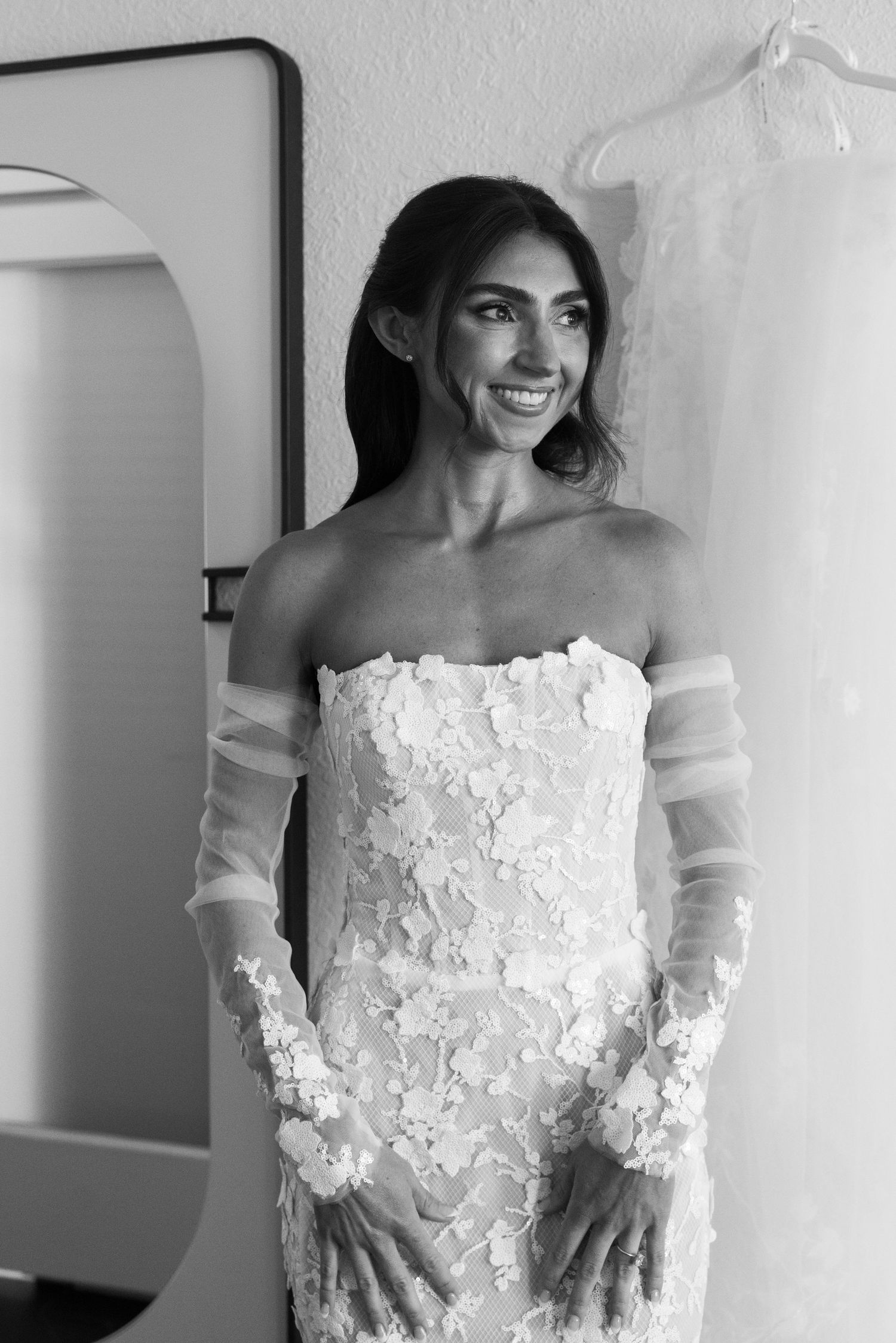 Series of photos highlighting the delicate lace details and sheer sleeves of a bridal gown.