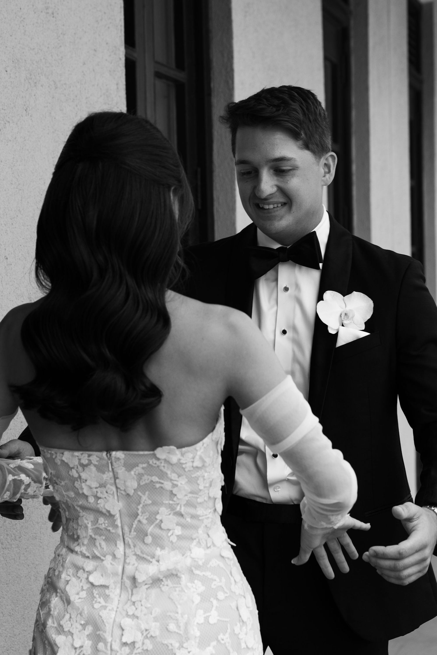 A romantic black and white moment between newlyweds during their first look.
