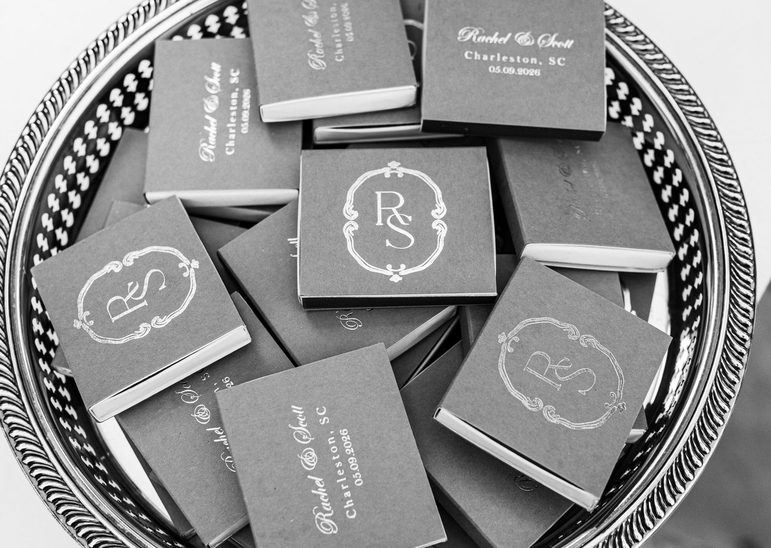 Personalized monogram matchbooks on a decorative silver tray, elegant wedding favors featuring RS initials in Charleston, SC.