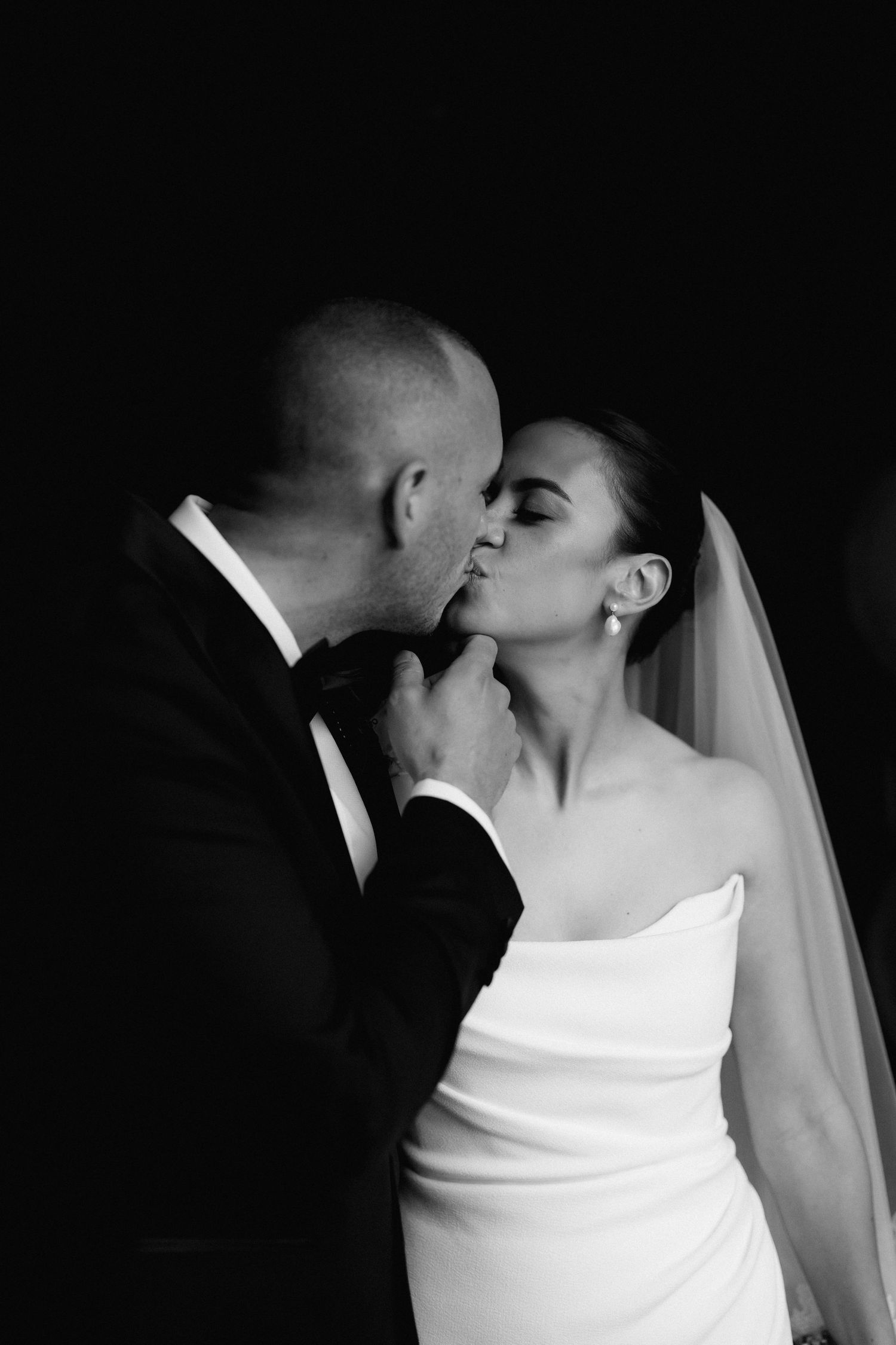 Intimate black and white wedding portraits showing romantic moments.