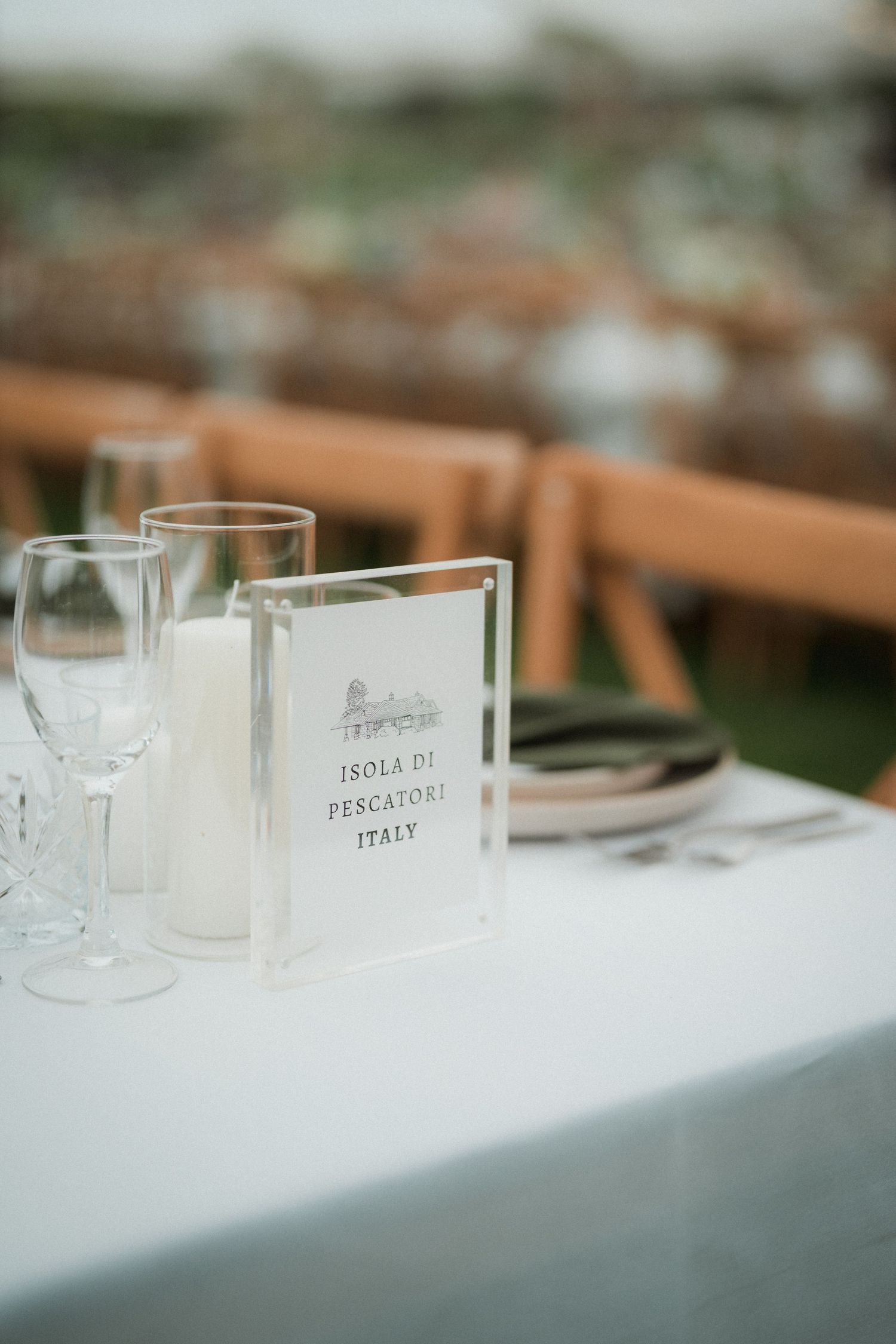 Elegant table setting with wine glasses and menu cards at an upscale event.