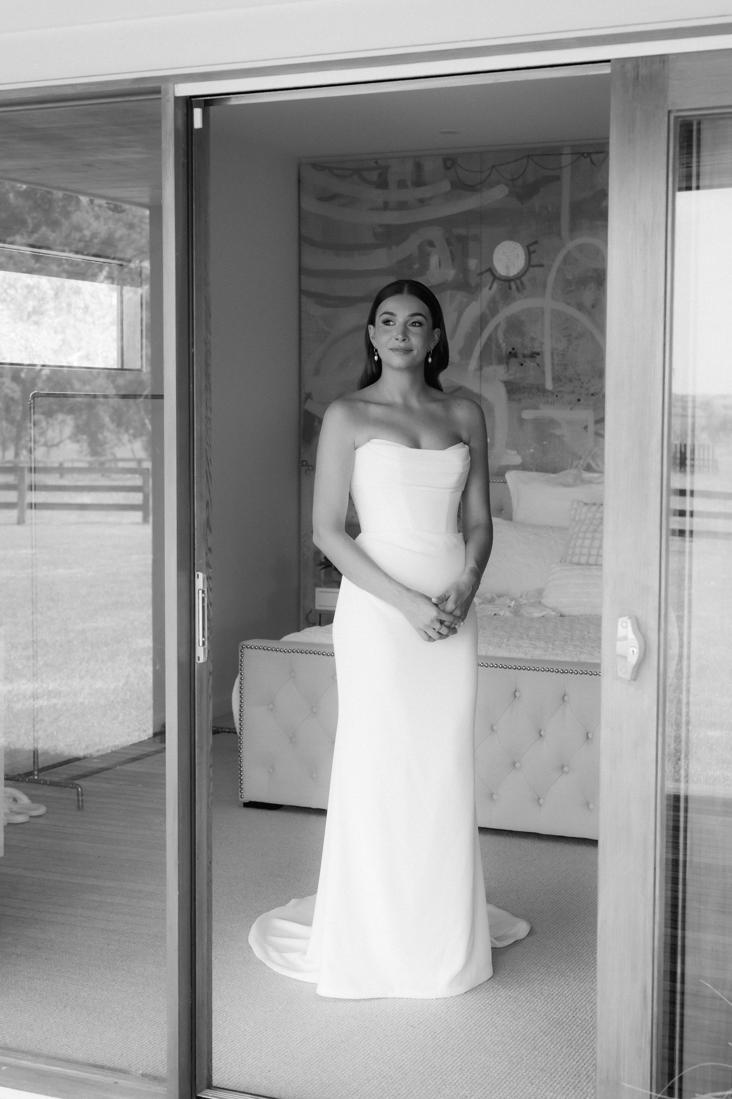 A series of wedding dress preparation photos showing a white gown being fitted in a bridal suite.