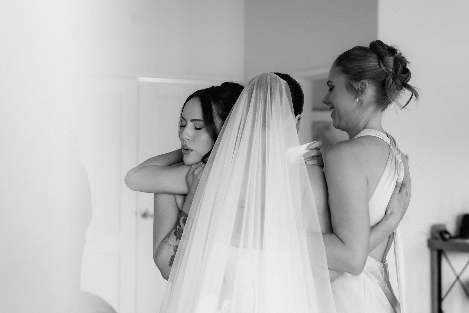 Black and white photo series showing intimate moments of a bride getting ready on her wedding day.