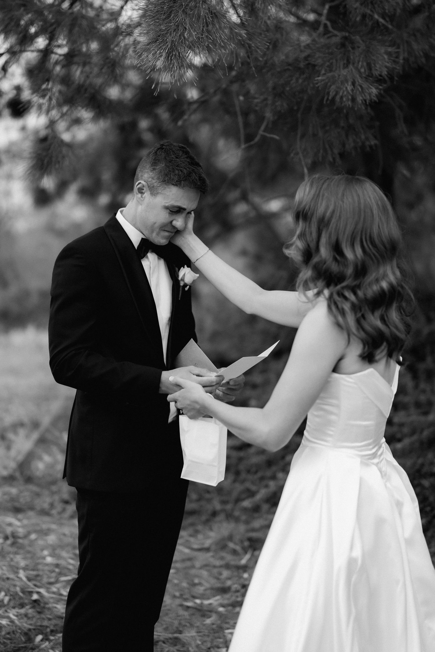 A romantic sequence of black and white photos showing a couple dancing together in formal wedding attire.