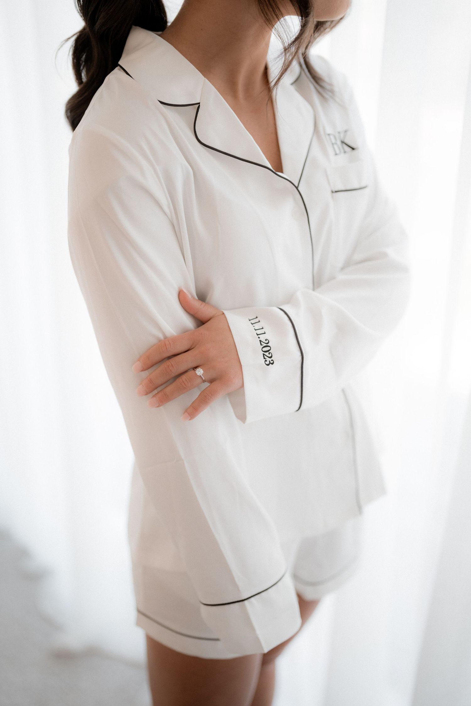 White button-down sleepwear set with black piping trim shown in multiple angles against light background.