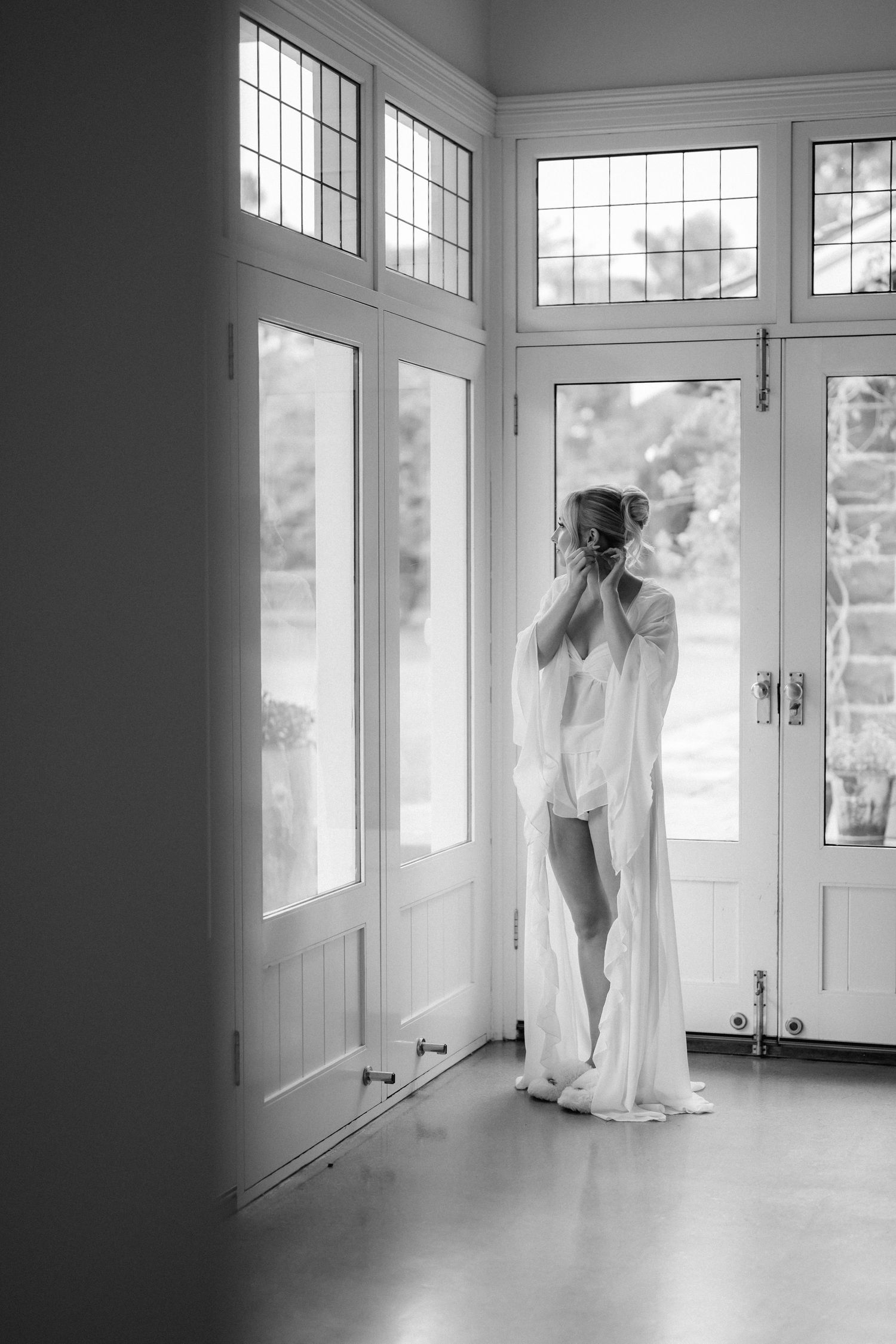 A series of ethereal white wedding dress photos in a bright sunlit room with large windows.