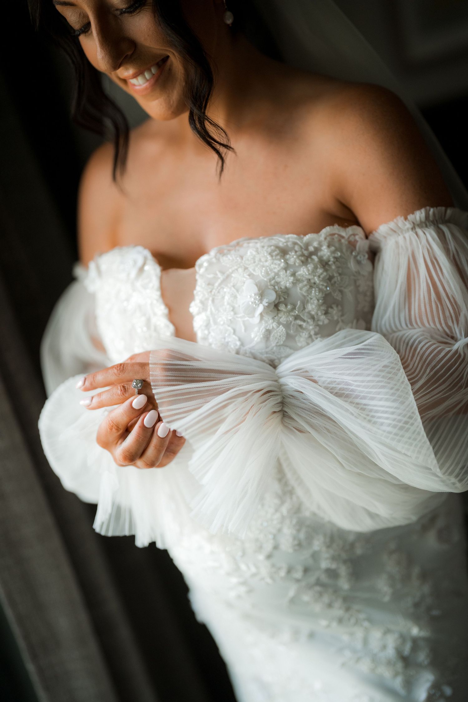 Elegant white lace wedding dress with sweetheart neckline and delicate details.