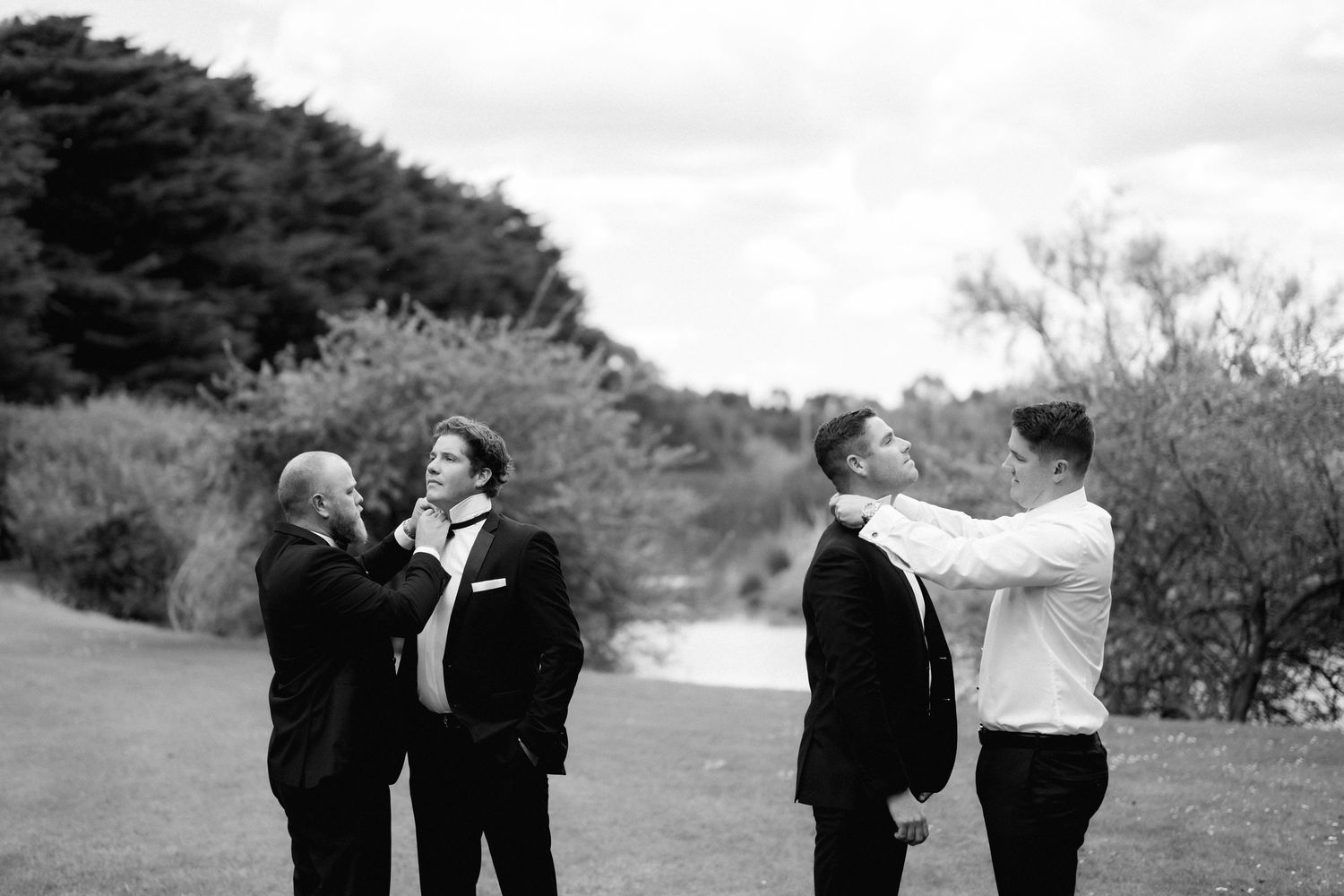 A sequence of five candid black and white photos showing a group having fun together outdoors.