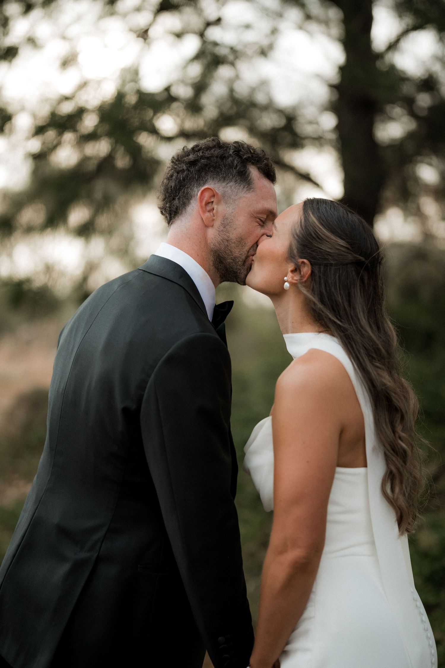 Series of romantic wedding couple portraits at sunset showing intimate moments between newlyweds.