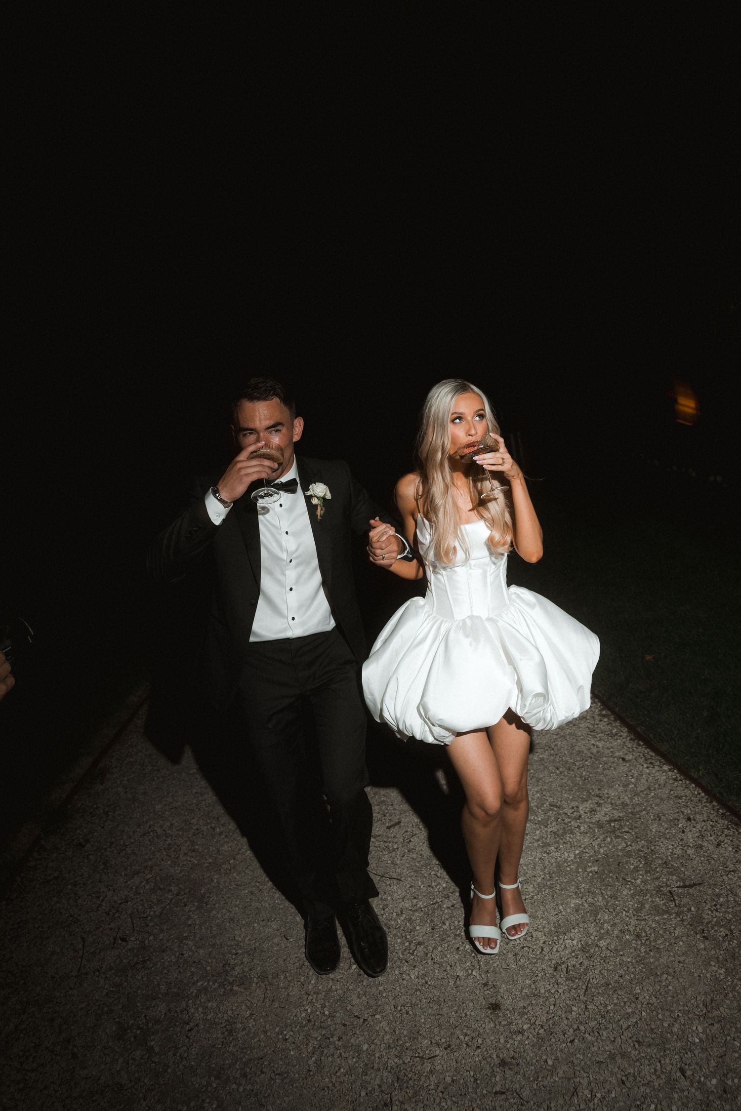 A sequence of photos showing two people in formal attire walking away on a dark path at night.